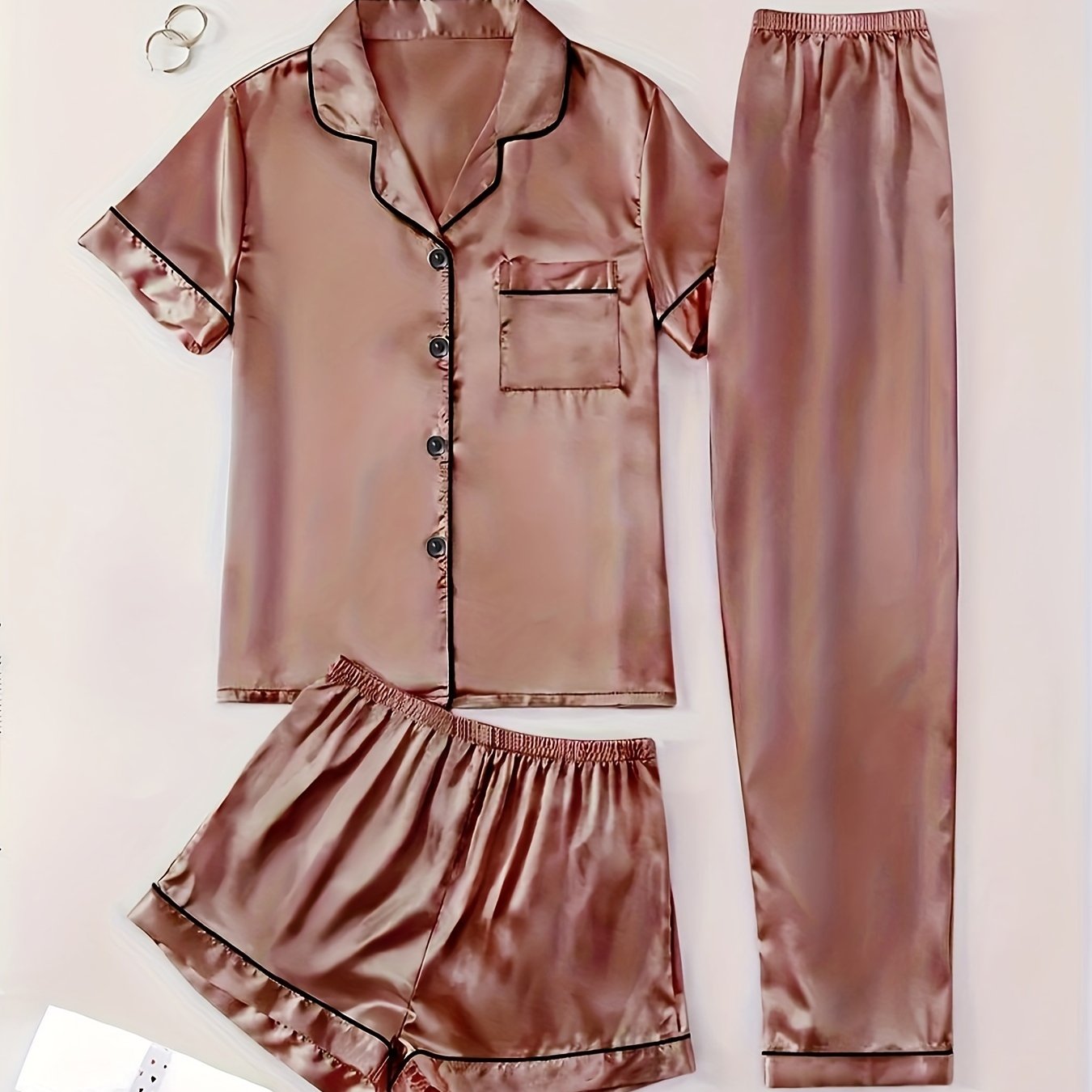 3-piece summer satin pajama set for women featuring collared shirt, long pants, and shorts. Made of 95% polyester and 5% elastane. Available in sizes S-XL.