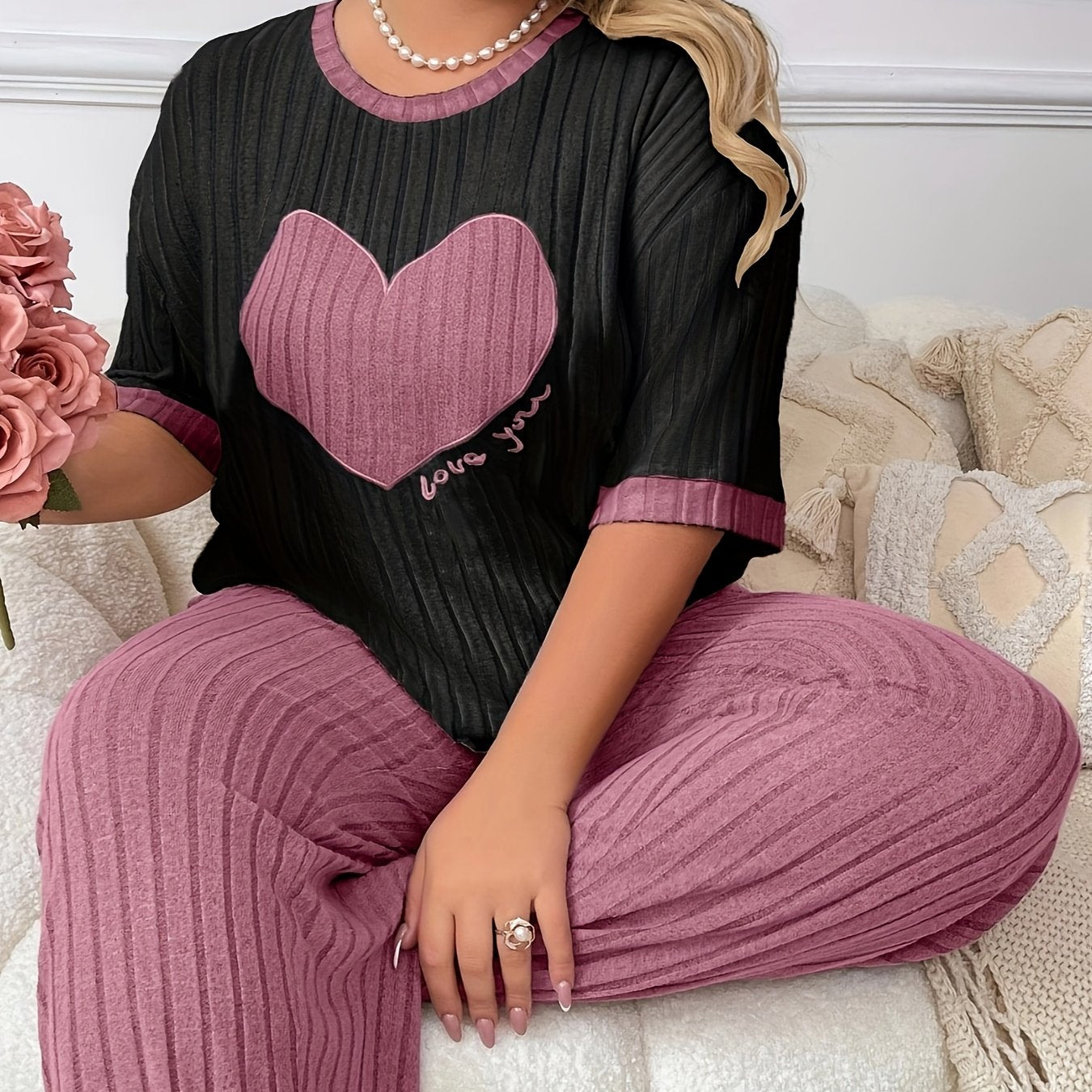 Cozy heart embroidered pajama set in plus size, includes short sleeve top and long pants made of soft polyester. Machine washable.