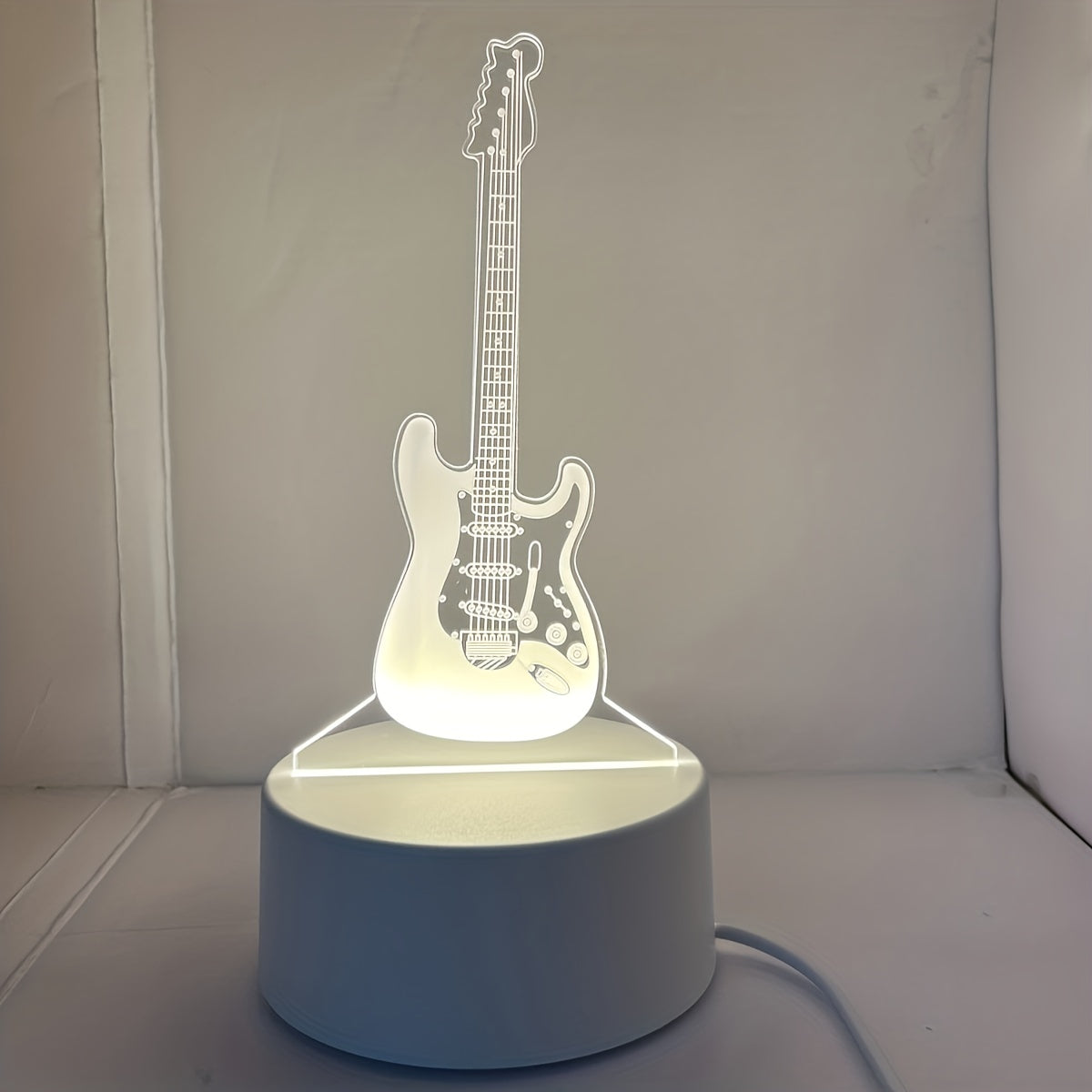 3D Guitar night light with warm white base, perfect gift for friends or room decoration.