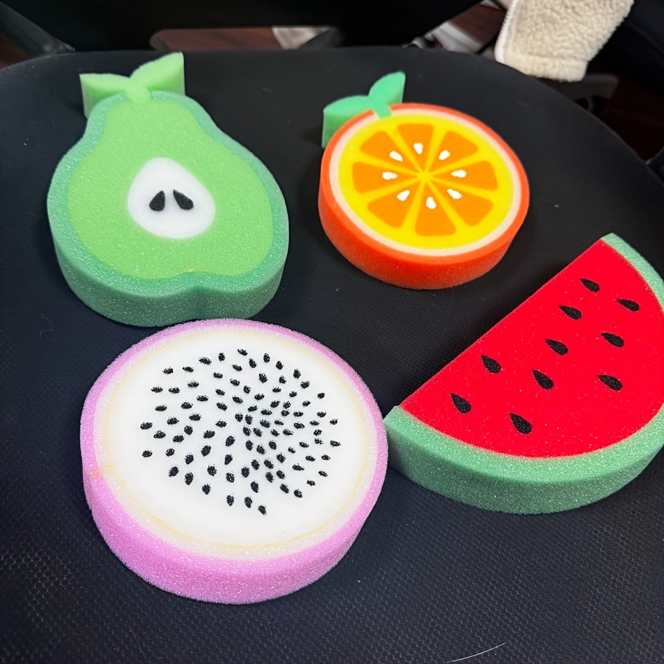 Set of 4 fruit-shaped cleaning sponges made of polyurethane. These multi-purpose scouring pads are perfect for use in the kitchen, bathroom, dishes, car wash, and supermarket. The set includes sponge shapes resembling a pear, orange, dragon fruit, and