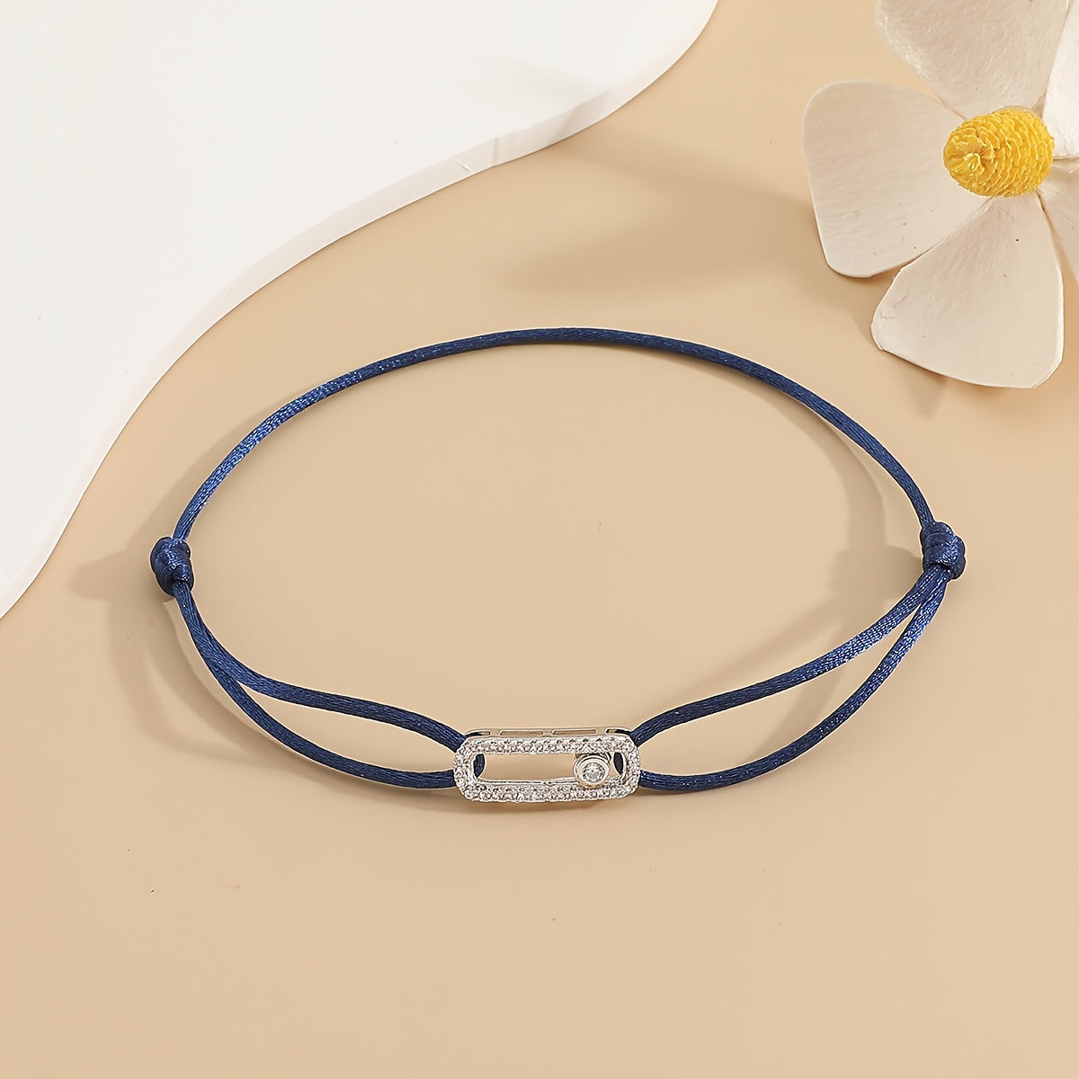 A stylish and timeless charm bracelet designed for women, featuring adjustable sizing and movable zirconia accents. This premium accessory is the perfect gift for any fashionable woman who appreciates high-quality jewelry.