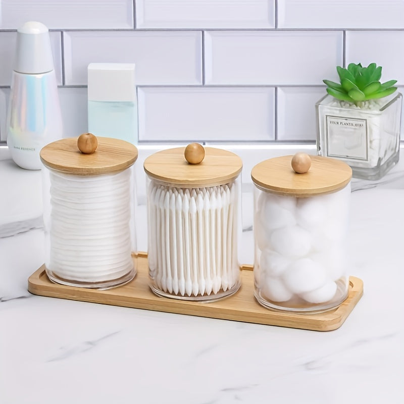 Set of 3 cotton swab/ball/pad holders with tray, apothecary jar with wood lids, and clear bathroom storage containers.