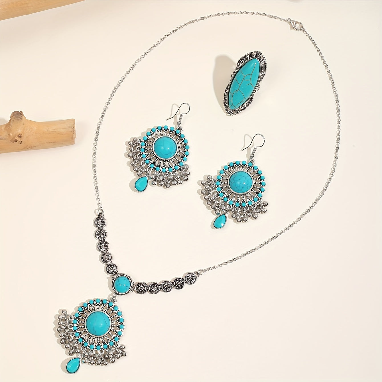 1 Boho style jewelry set featuring a pair of earrings, a necklace, and a ring. Inlaid with natural turquoise, this set is the perfect gift to complement any daily outfit.