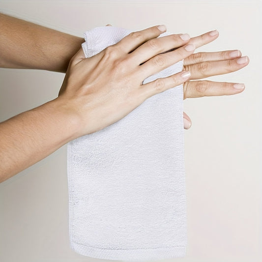 12-piece set of white cotton washcloths, lightweight and absorbent for home bathroom use.