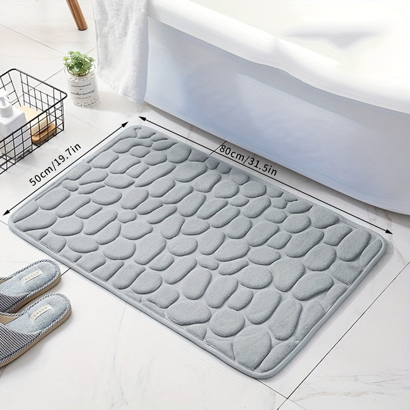 Soft, non-slip coral fleece bathroom mat in a pebble pattern. Quick-dry, machine washable, and low pile for comfort and home decor. Made of plush polyester fiber with knit fabric and 100% polyester material. 570gsm and 1.4cm thick.