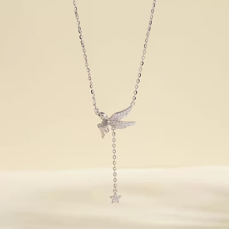 Sterling silver necklace with elf design, featuring a tassel and star pendant. This fashionable and minimalist clavicle chain is perfect for women who appreciate elegant French style. Inspired by celestial symbols, this piece adds a touch of charm to any