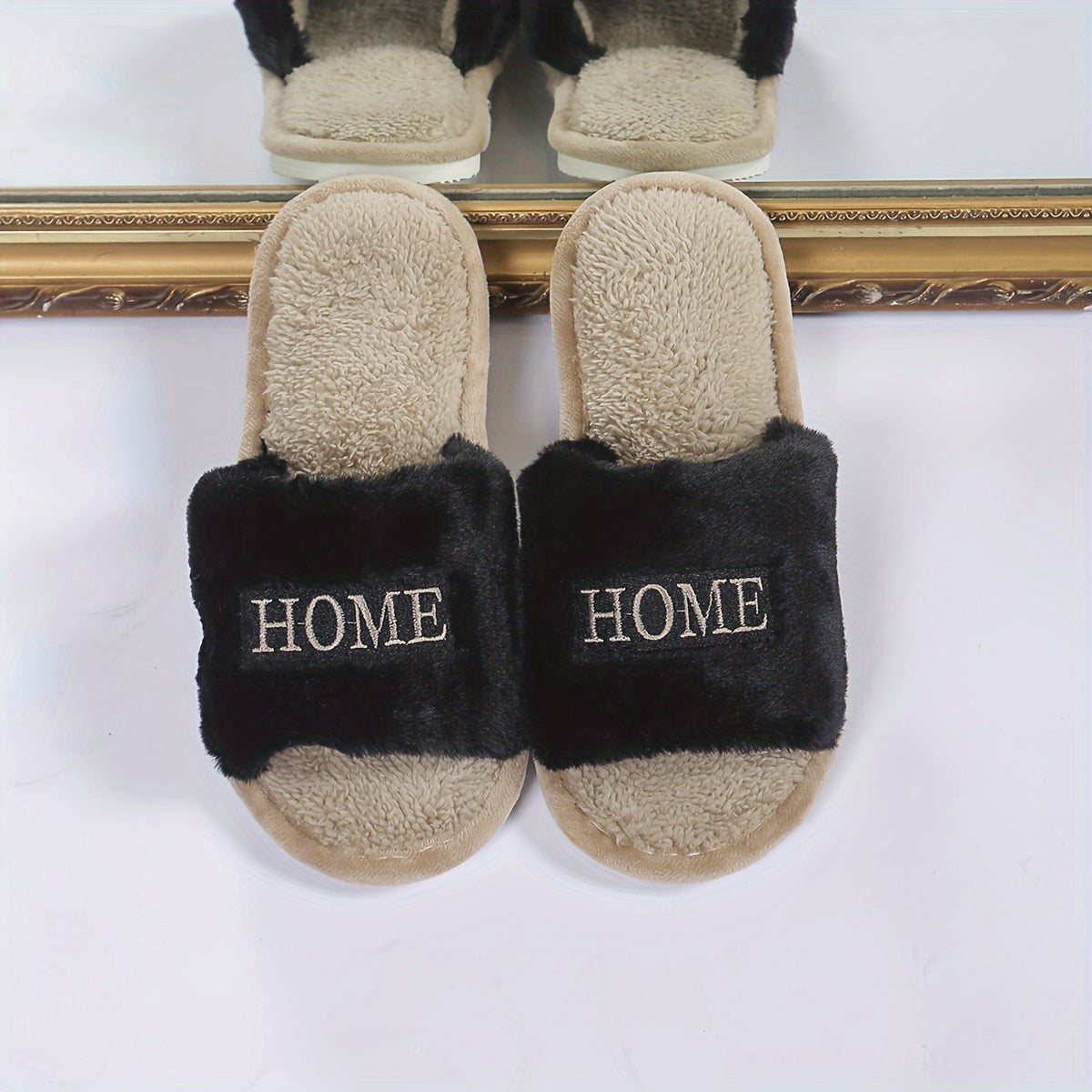 White plush slippers with "HOME" embroidery, cozy and comfortable for all seasons.