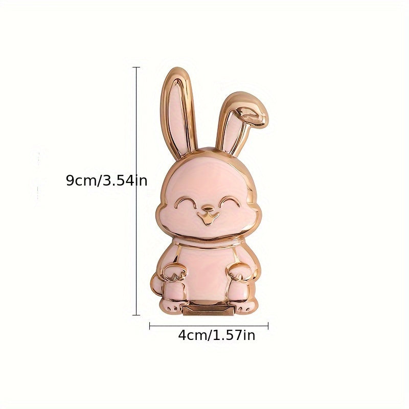 Foldable waterproof phone stand made of ABS material, featuring an adjustable cartoon bunny design for holding smartphones and tablets.