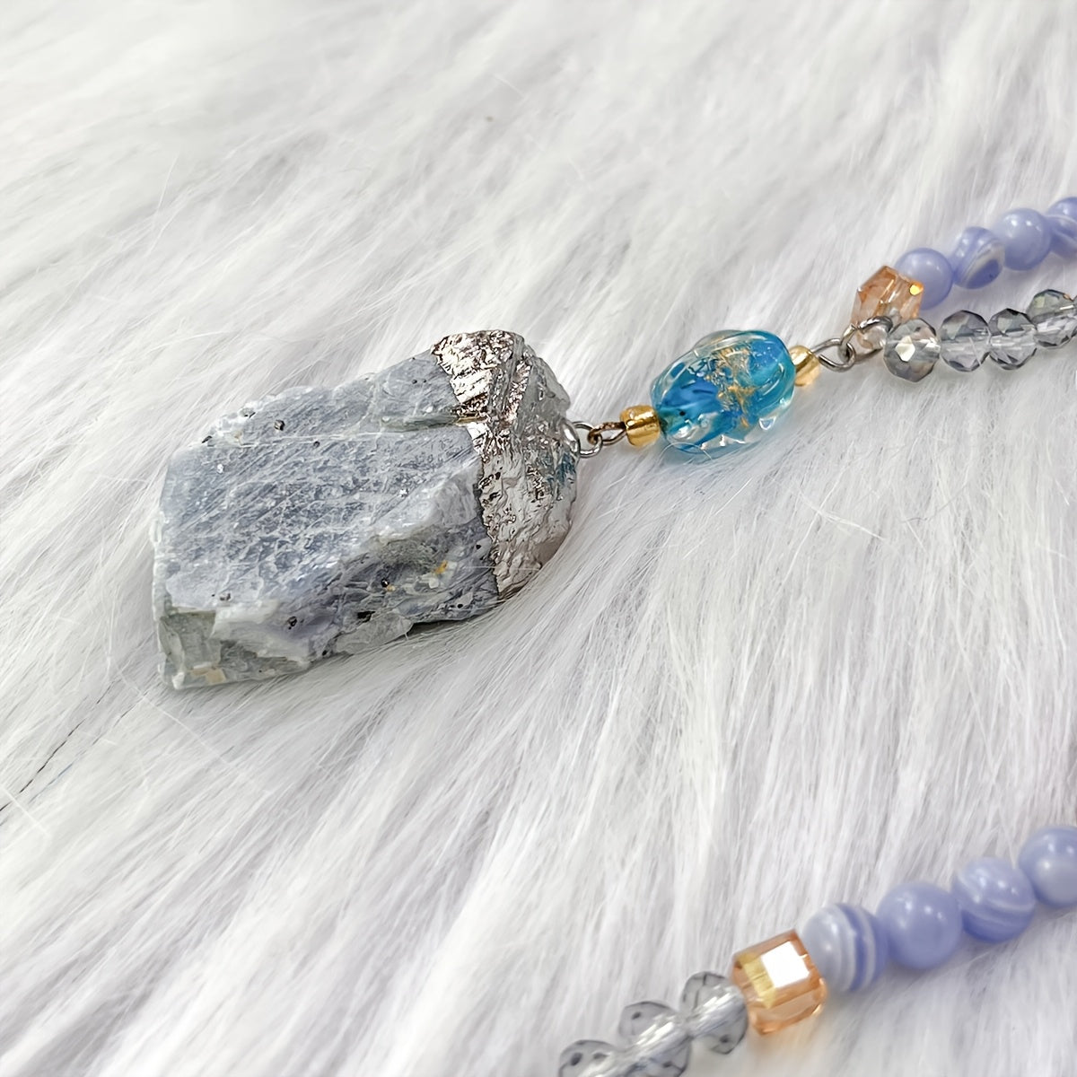 Unique vintage-inspired mala necklace featuring a raw kyanite pendant, beautiful blue lace agate and amazonite beads. Hand-beaded with love, this crystal japamala promotes chakra mindfulness and inner peace. This elegant boho accessory is perfect for any