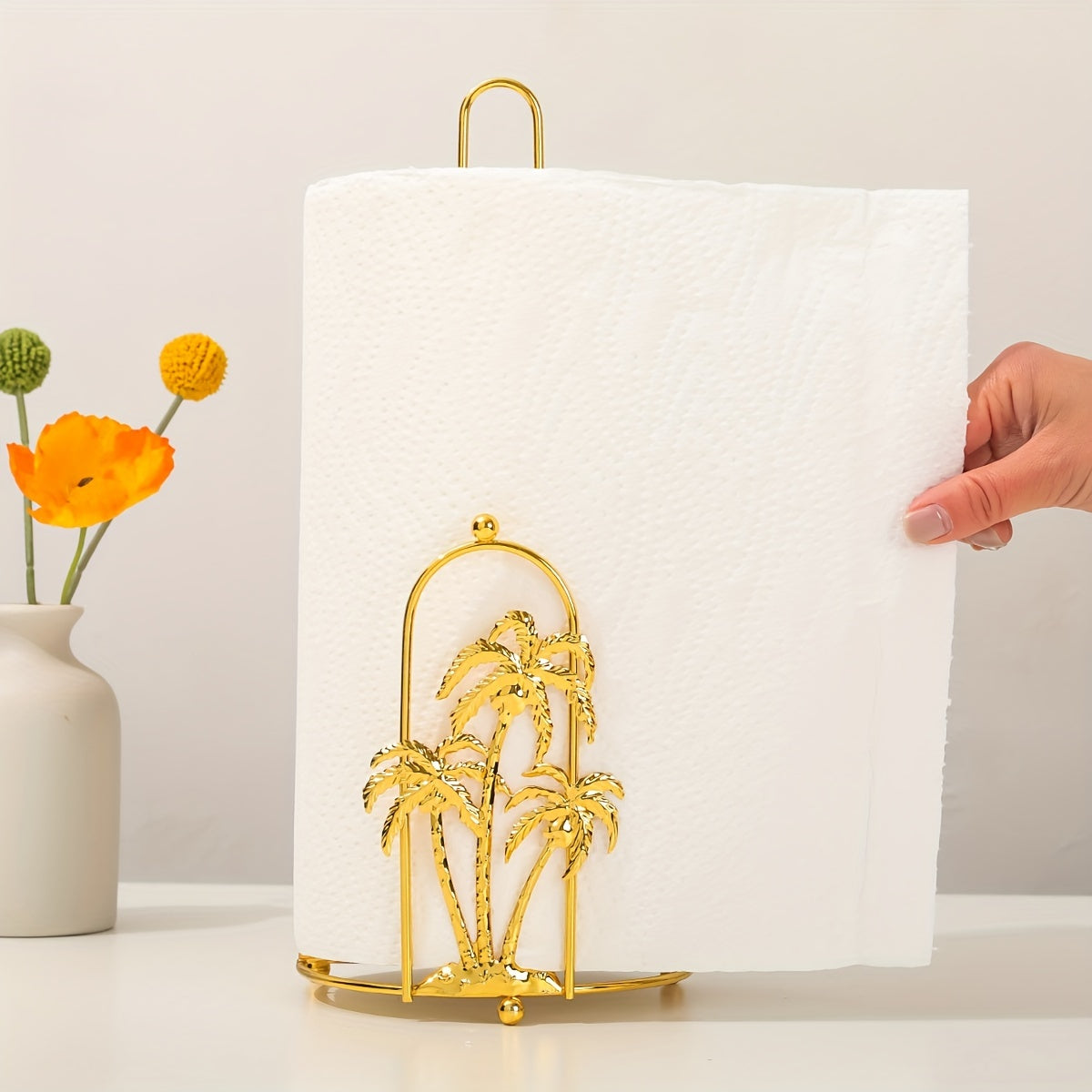 Iron paper towel holder with an elegant coconut tree design - no drilling required. Perfect for holding napkins and rags on countertops in the kitchen or bathroom.