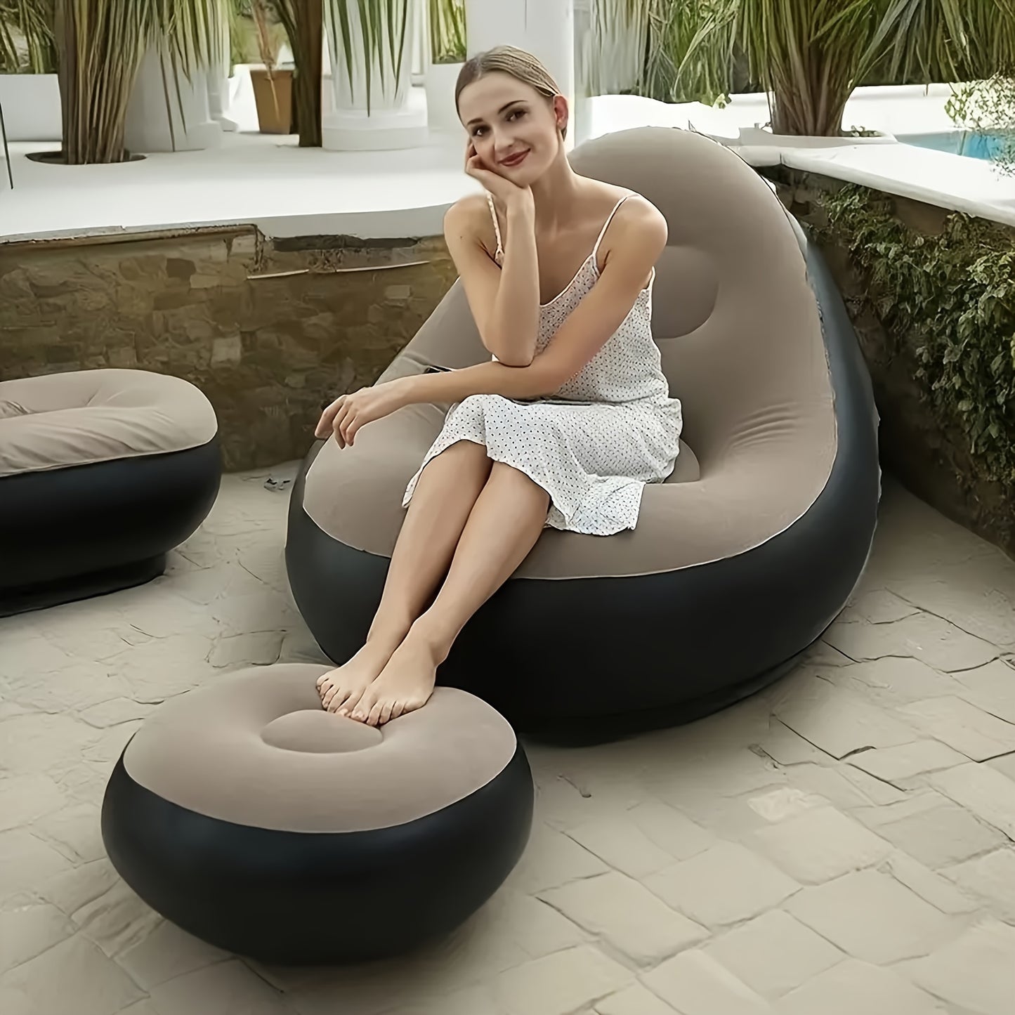 Portable inflatable lounge chair with footrest, suitable for both indoor and outdoor use.