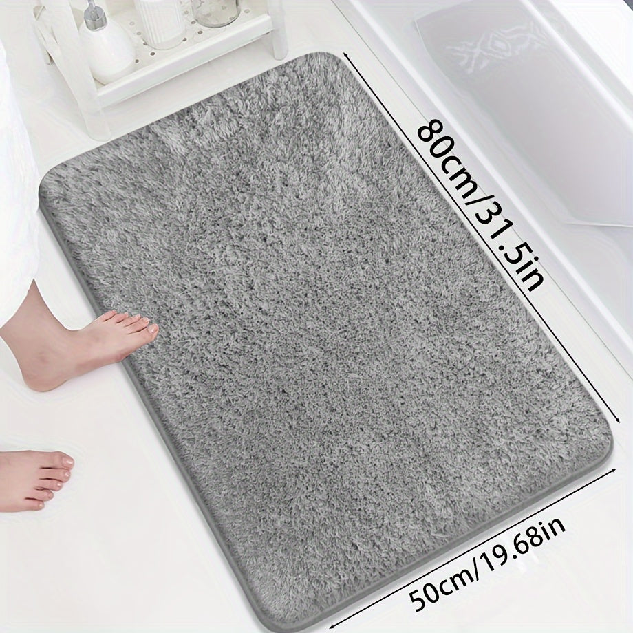 Soft and sumptuous purple bath mat offering luxury feel - highly absorbent, non-slip and fade-resistant, ideal for bathroom, bedroom and laundry room décor. Made from durable polyester, easy to clean.