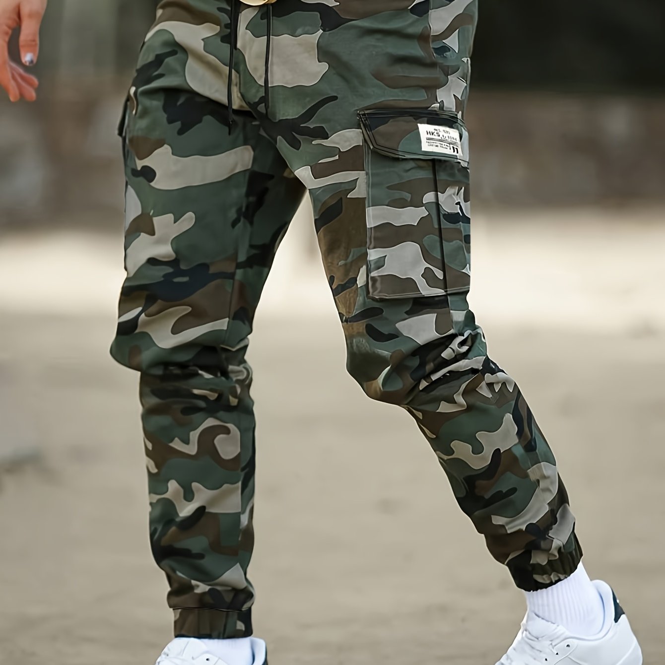 Camouflage cargo pants for men, ideal for outdoor activities in spring and autumn.