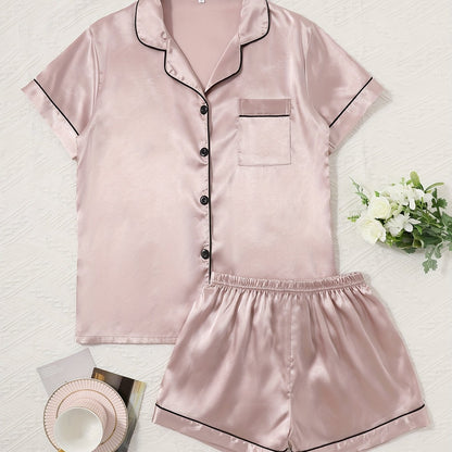 Women's satin pajama set with short-sleeve top and button-up shorts.