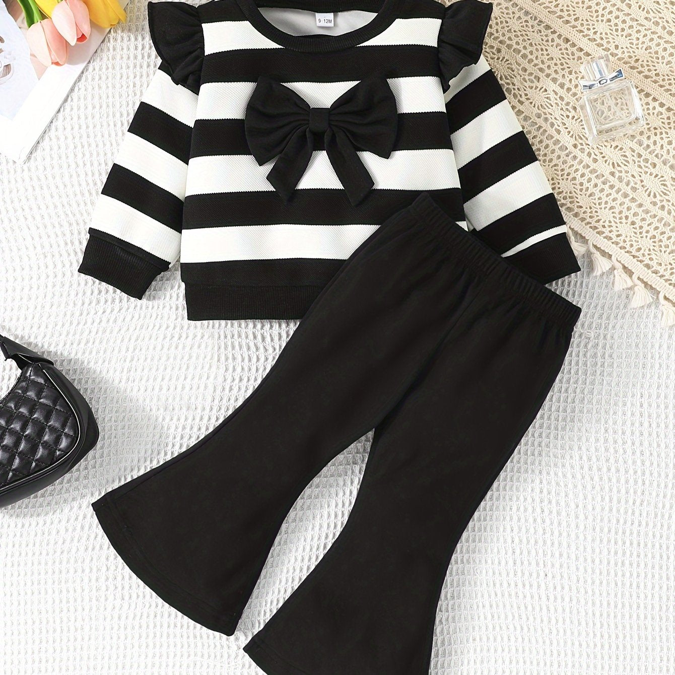 Stylish girls' casual outfit with striped top and matching bell pants, great for outdoor activities in spring and autumn.