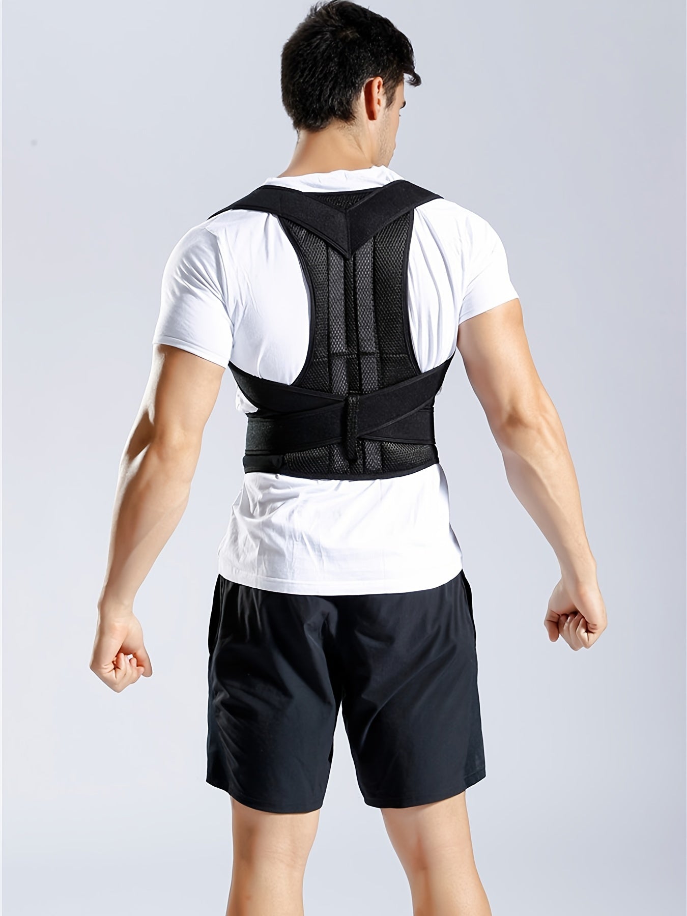 Flexible posture corrector vest with lumbar and shoulder support for improved posture and back pain relief.