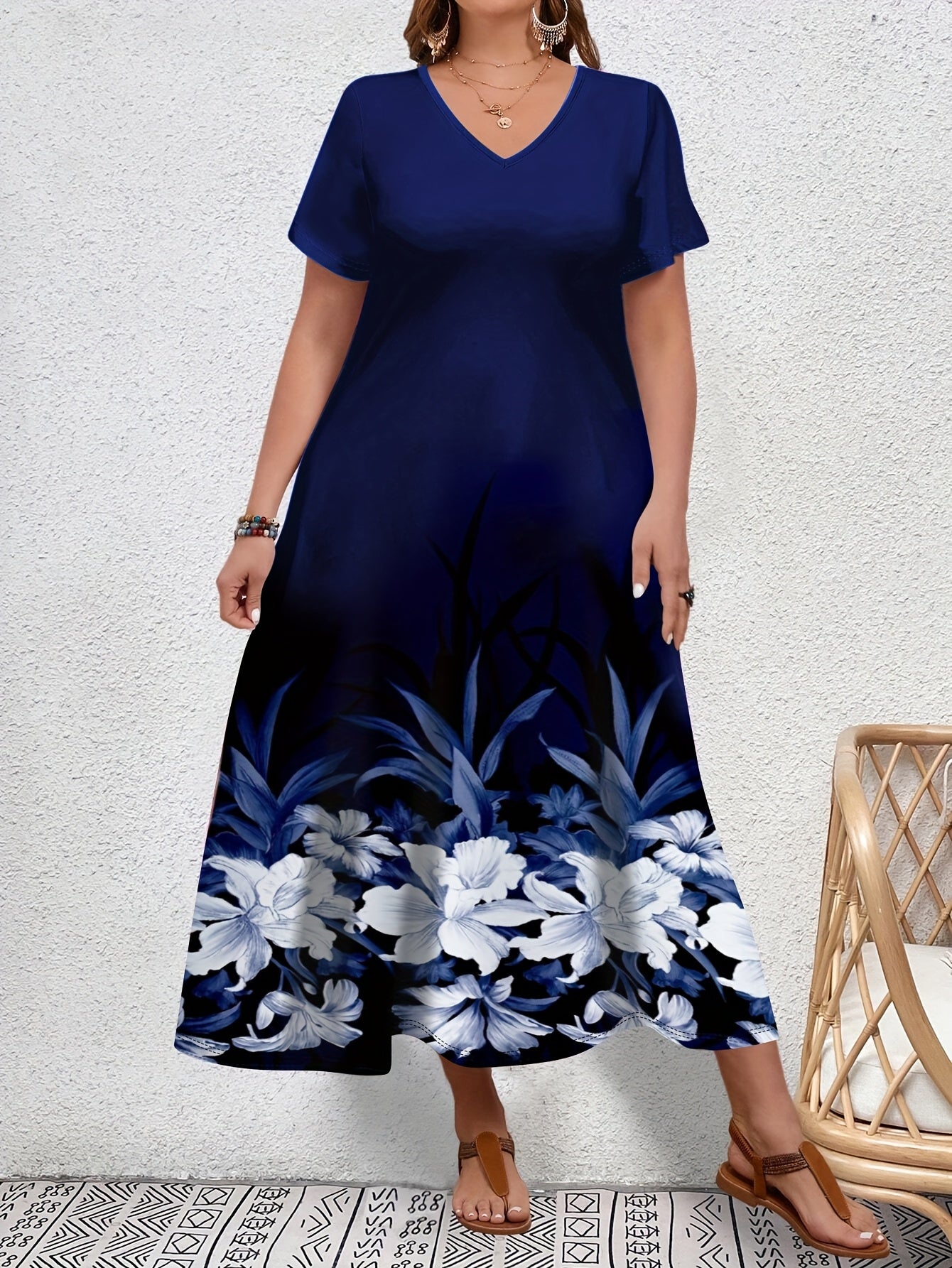 Stylish plus size floral print v-neck dress for women, slim fit with slight stretch, made of polyester knit fabric.