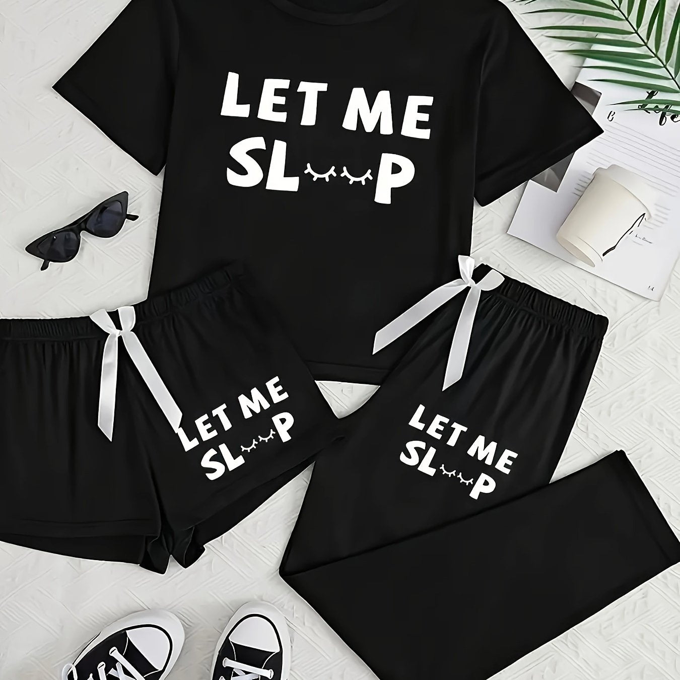 Casual pajama set with letter print, short sleeve top, long pants, and shorts.