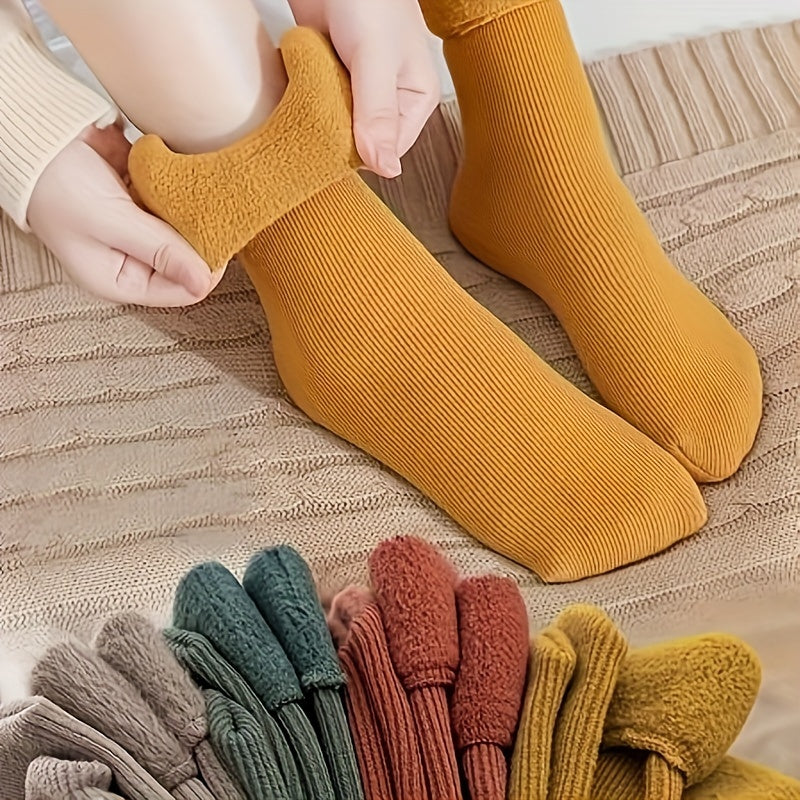 4 pairs of cozy thermal snow socks perfect for winter, lined with fleece for extra warmth, great for casual wear.