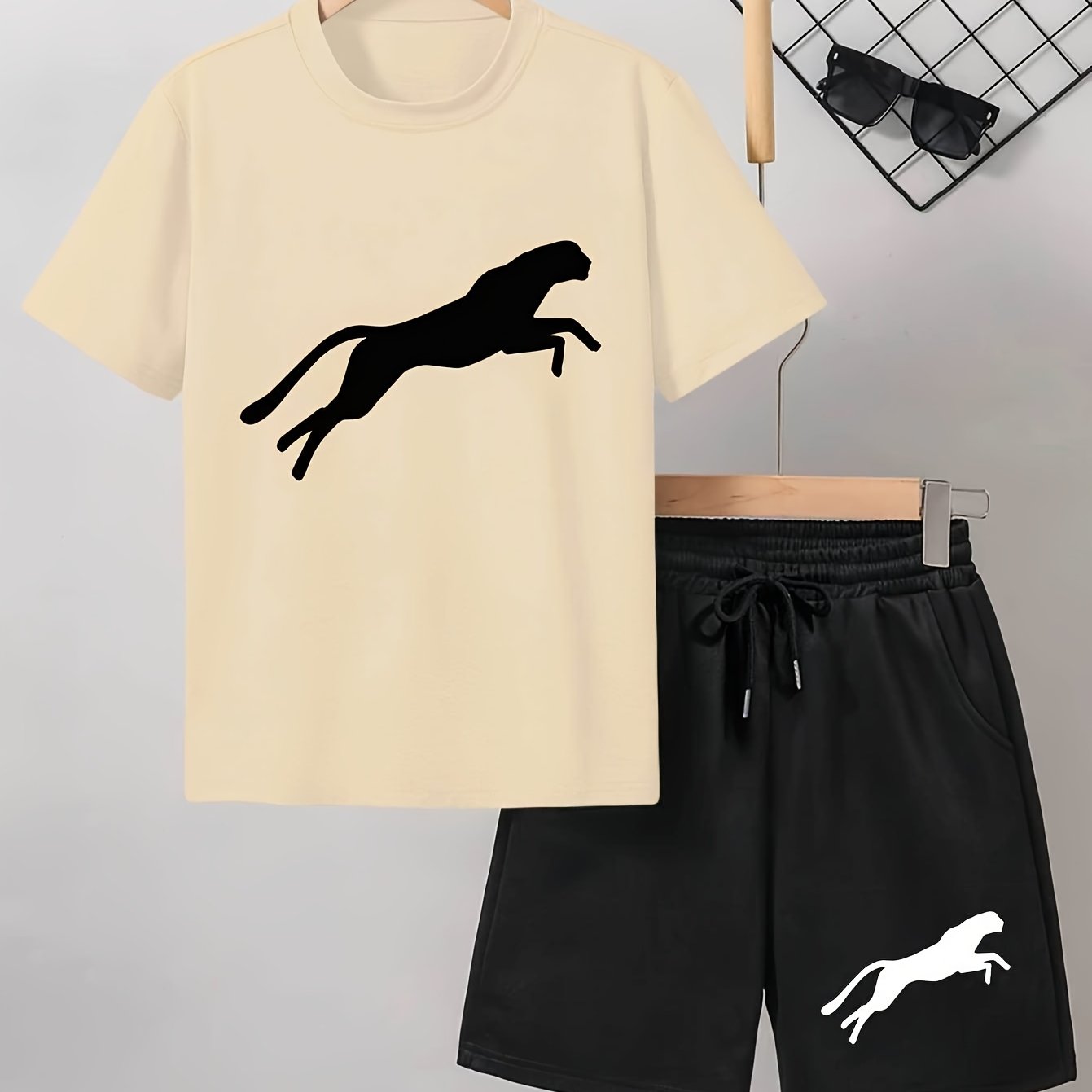 Men's casual Leopard Print Tee and Shorts Set in Light Gray with a Black Leopard silhouette on the t-shirt and White Leopard design on the black shorts. Made of a polyester blend for a