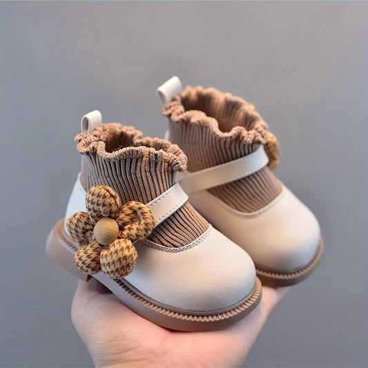 Cute baby shoes with soft soles, ankle-high design, and floral and cloud patterns for any season.