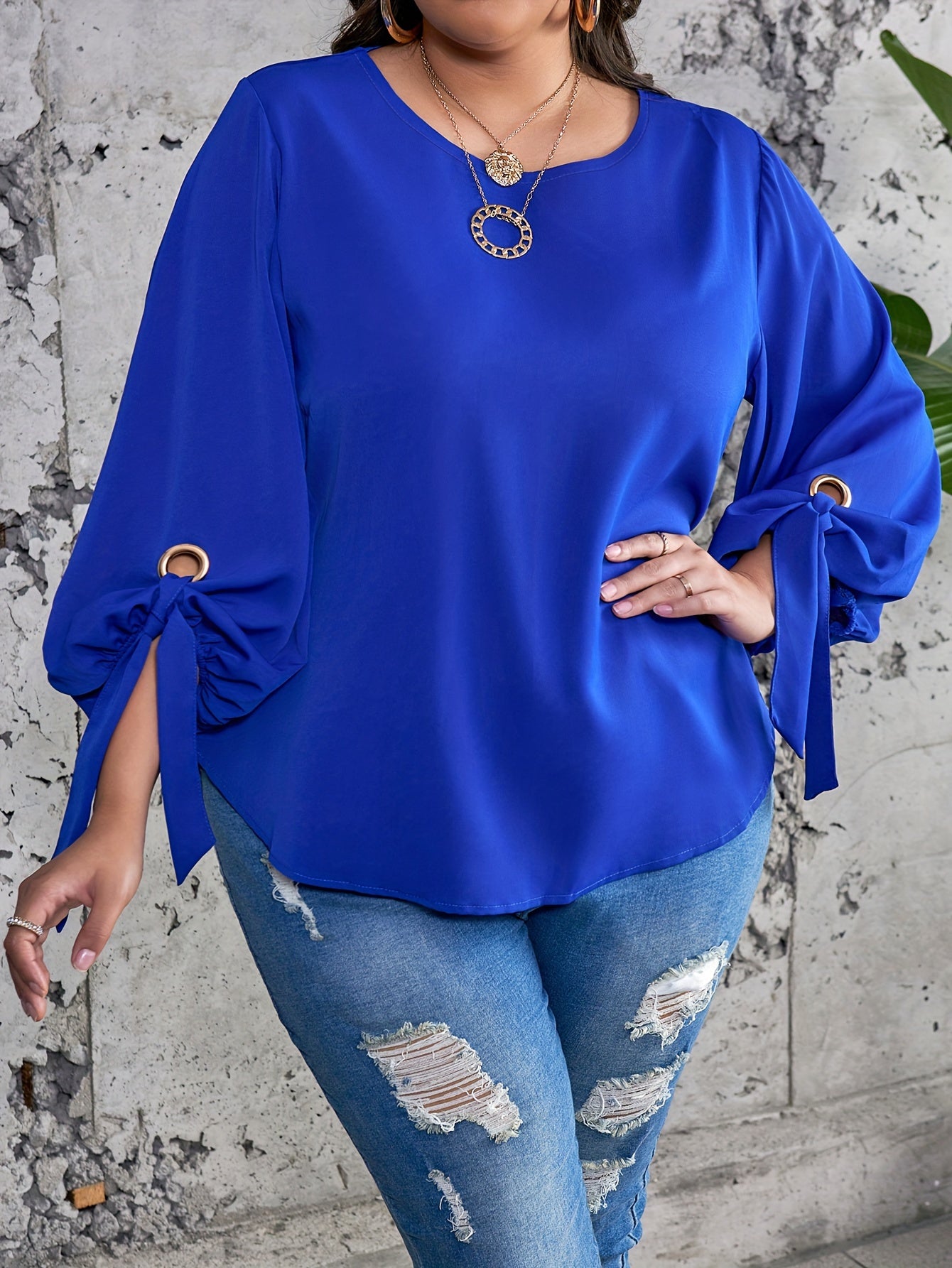 Elegant plus size royal blue satin blouse with tie sleeves, round neck, and smooth texture. Perfect for spring, summer, and fall.