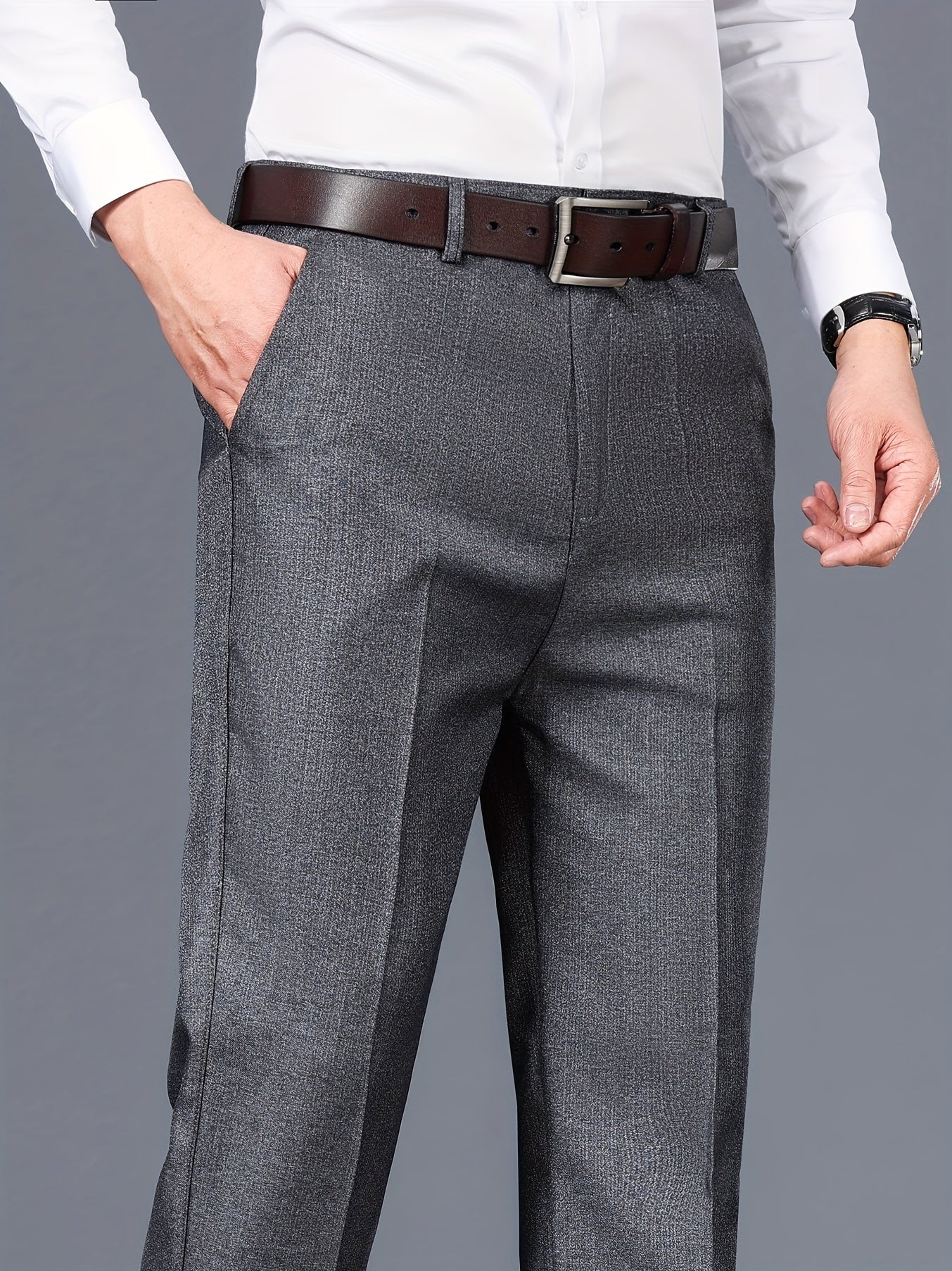 Gray dress pants for men with a straight fit, medium thickness, slant pockets, zip closure, and non-stretch polyester fabric. Suitable for business casual or formal wear in spring and