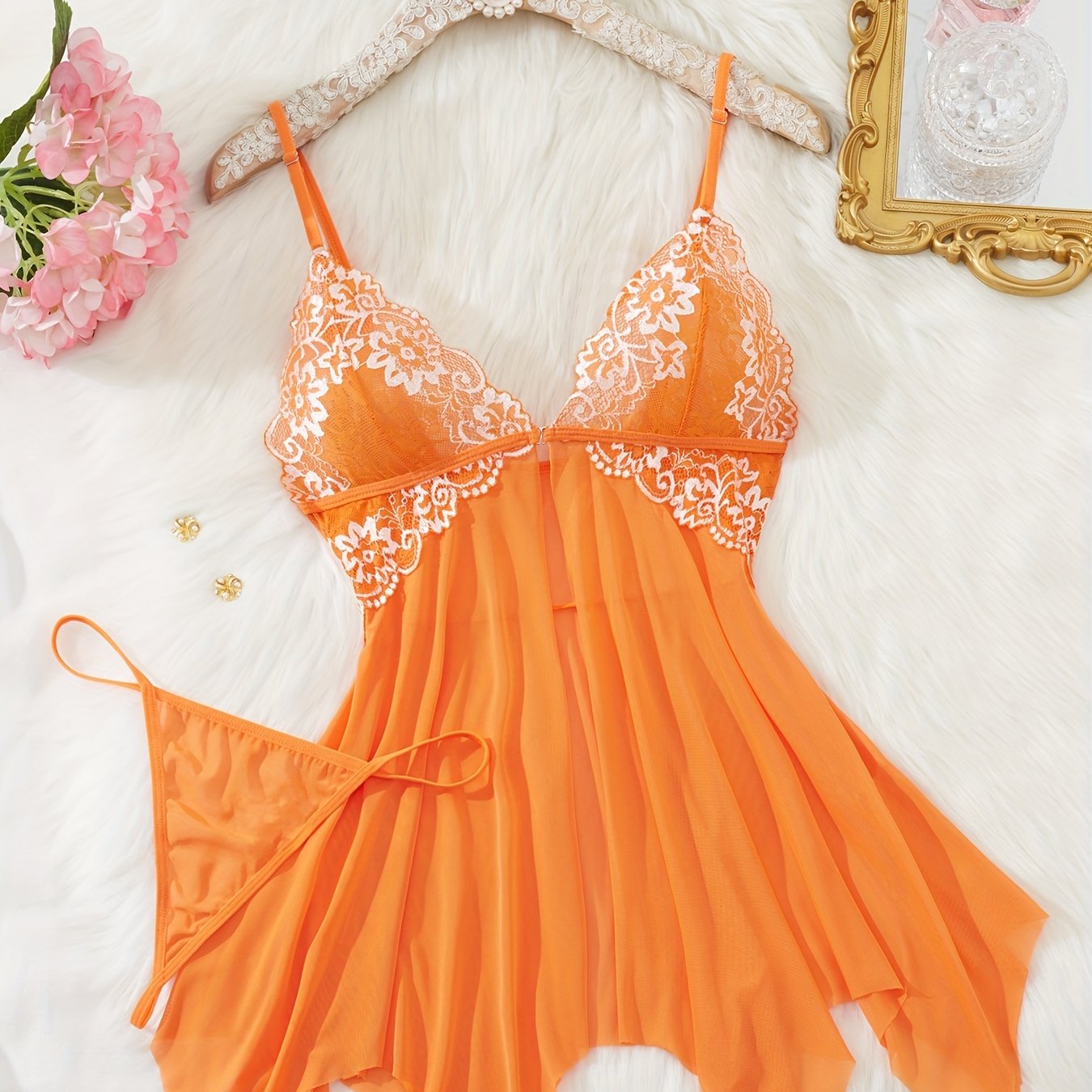 Stylish lace babydoll dress set with thong, featuring V-neck, backless design, floral patterns, and soft polyester blend. Perfect for romantic evenings.