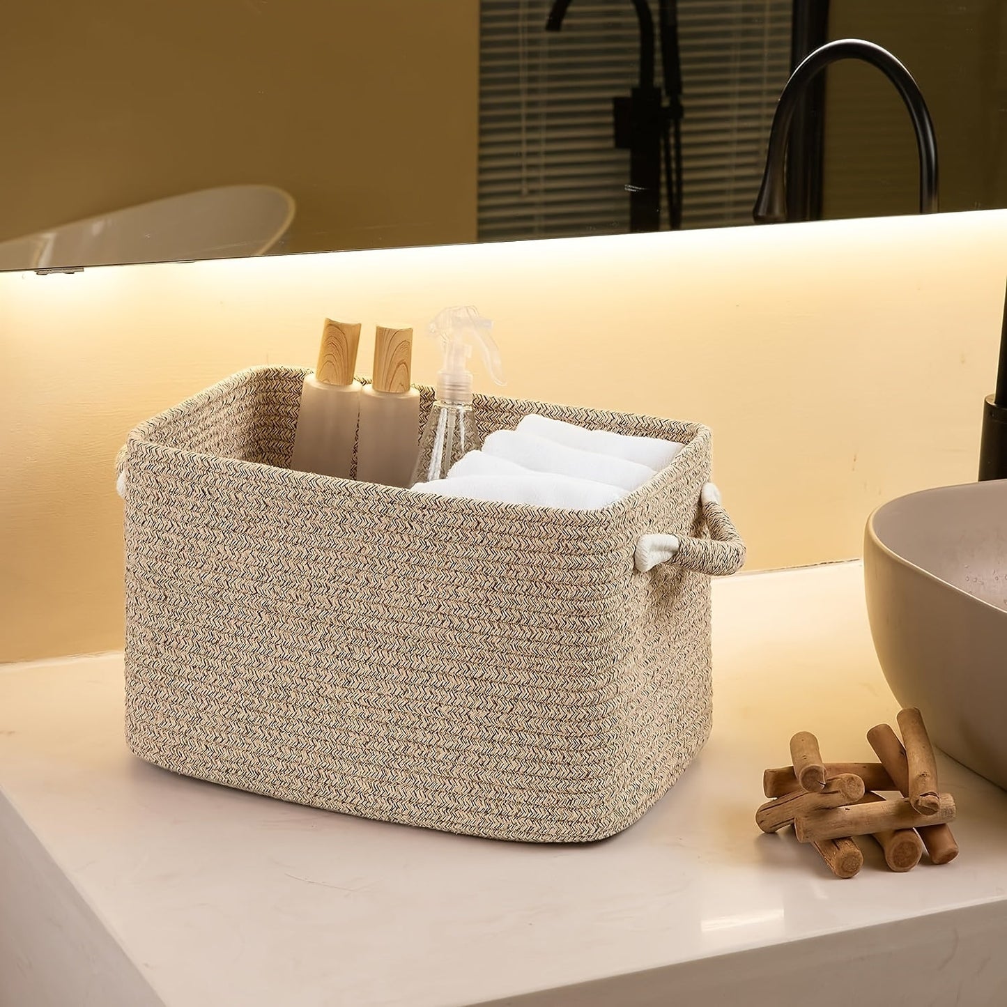 This multi-functional woven storage basket, measuring 37.59cm x 24.89cm x 22.35cm, is ideal for organizing bathroom towels, toys, nursery essentials, and laundry. Its versatile design makes it perfect for use as a weaved storage basket, shelf, cube, or