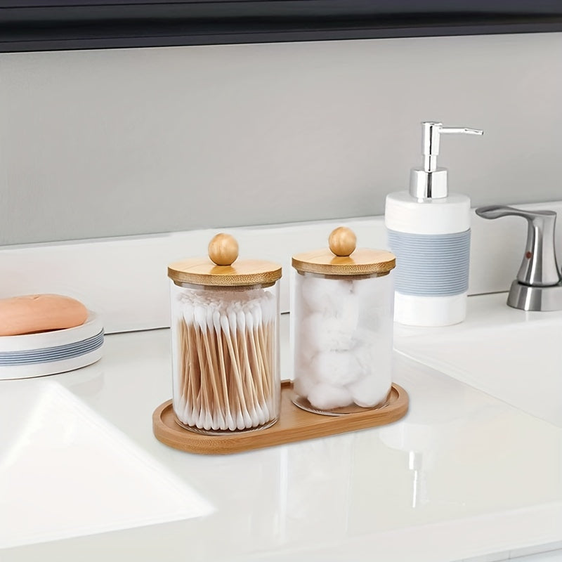 Holder dispenser set with bamboo lids and tray for bathroom storage including cotton swab, ball, pads, and floss.