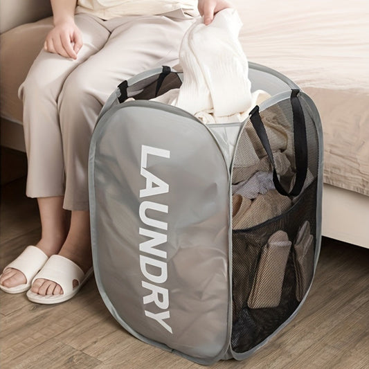 Get organized with the 1pc Casual Foldable Laundry Basket featuring mesh sides. This cloth portable clothes hamper is perfect for storing laundry in your bathroom, bedroom, or dorm room. With its elongated design, this roomy storage organizer includes