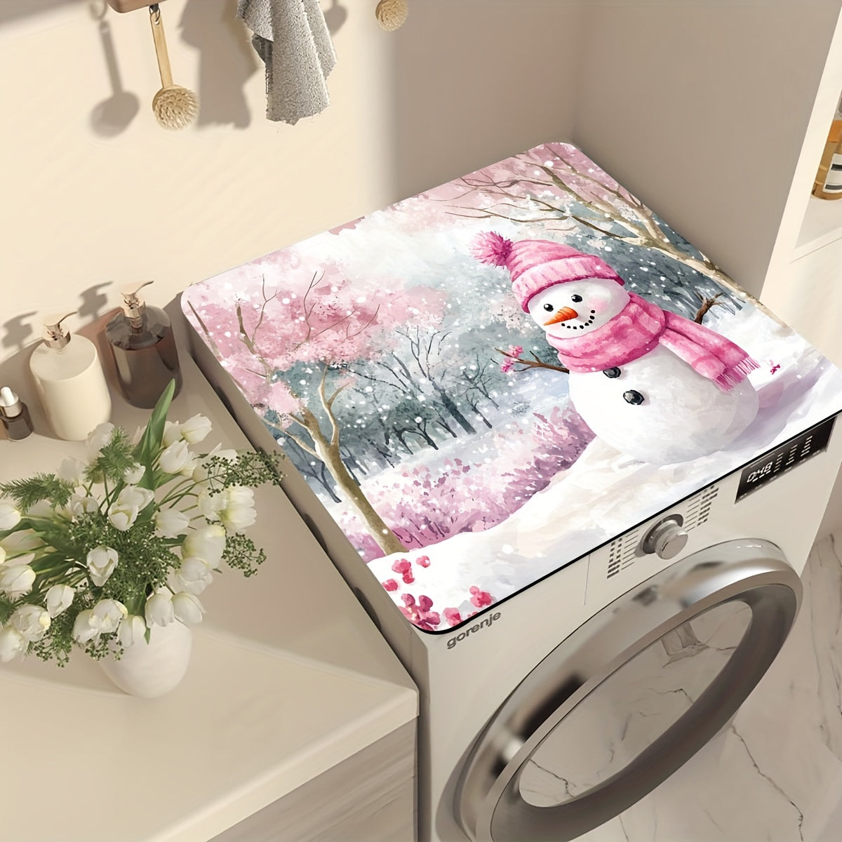 Keep your washing machine clean and festive with this 1-piece dust cover featuring a pink snowman and cherry blossom winter scene. This cover is quick-drying, absorbent, and non-slip, providing protection for your appliance and adding a decorative touch