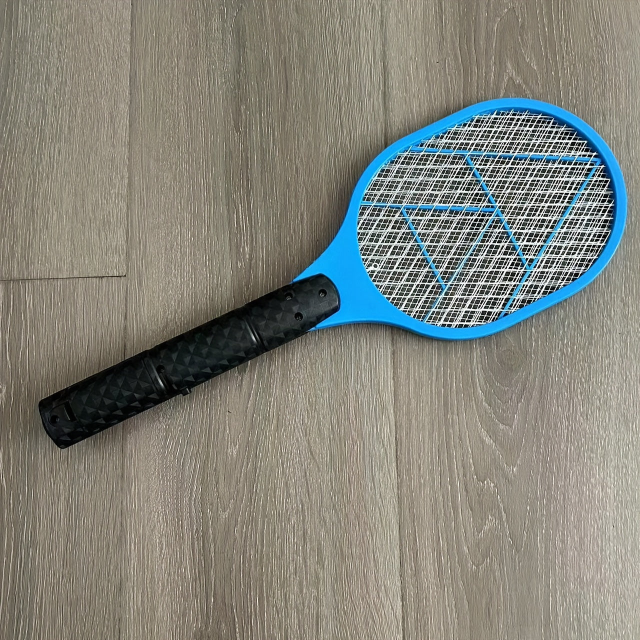 Electric fly and mosquito swatter that operates on batteries (AA batteries not included), made of durable plastic/aluminum/tin.