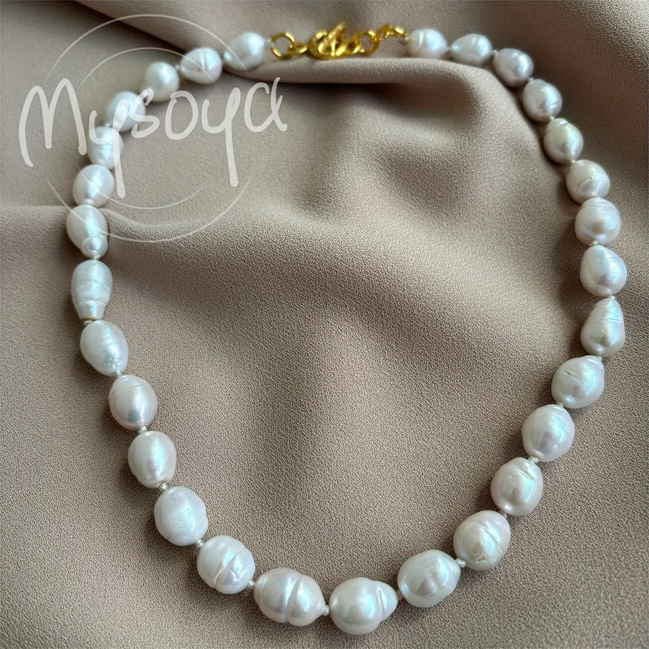 Exquisite handcrafted baroque pearl necklace featuring 10-12mm natural freshwater pearls. This stunning piece of jewelry comes beautifully packaged in a gift box, making it the perfect accessory for both daily wear and special occasions.