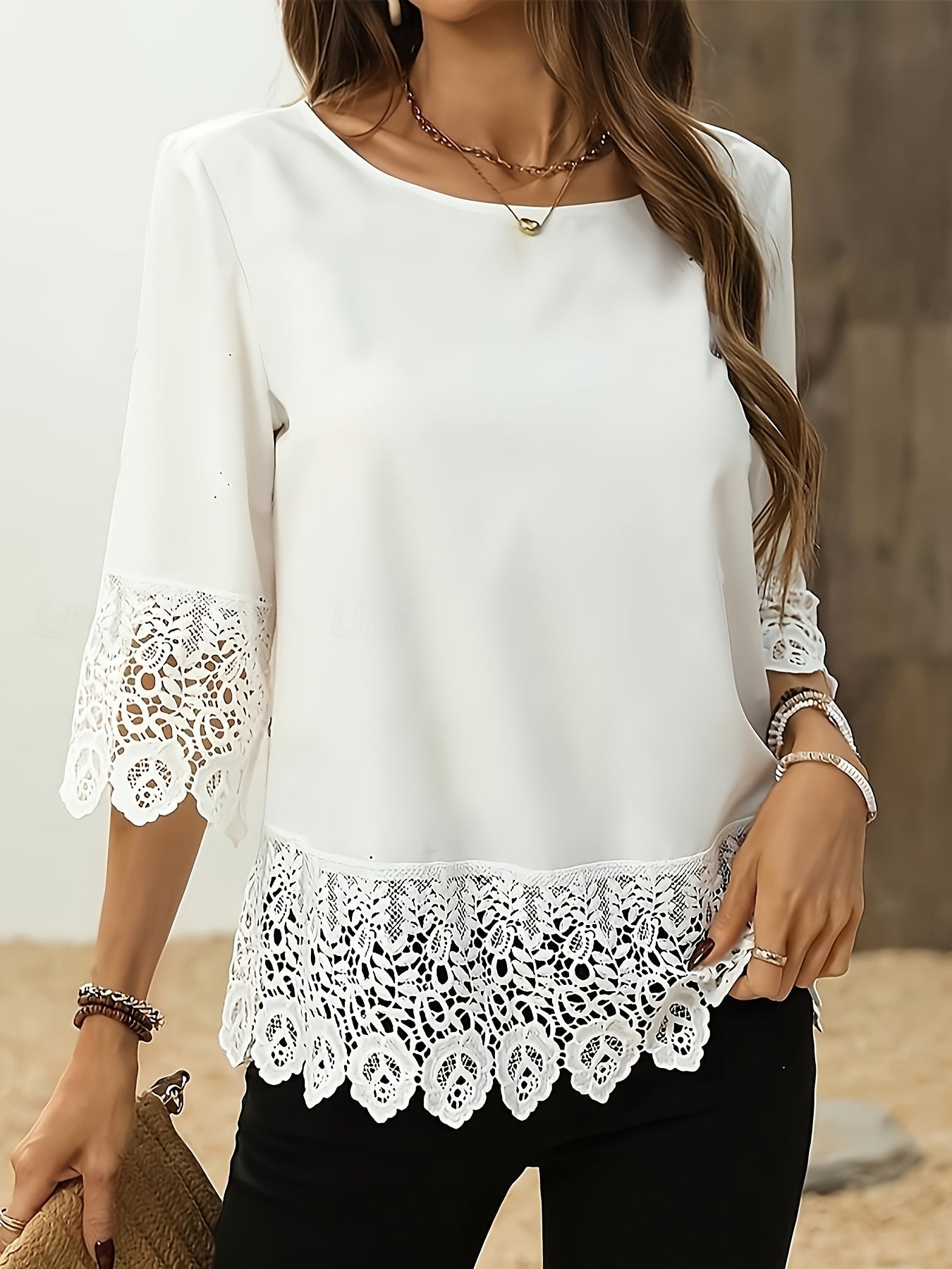 Elegant white plus size blouse for women made of polyester. Features round neck and half sleeves, ideal for spring and summer wear.