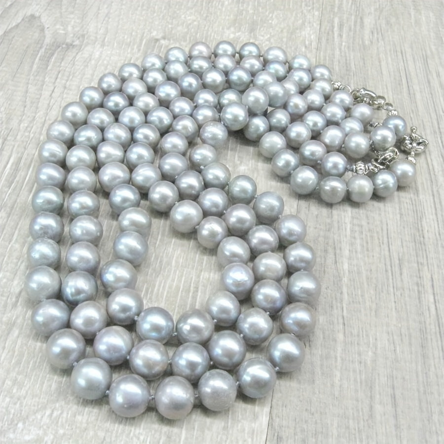 This MYSOYA natural freshwater pearl necklace is handmade with care and features 100% silvery gray pearls. The vintage elegant style and 10-12mm pearls make it a versatile piece of unisex jewelry. It comes in a beautiful gift box, making it the perfect