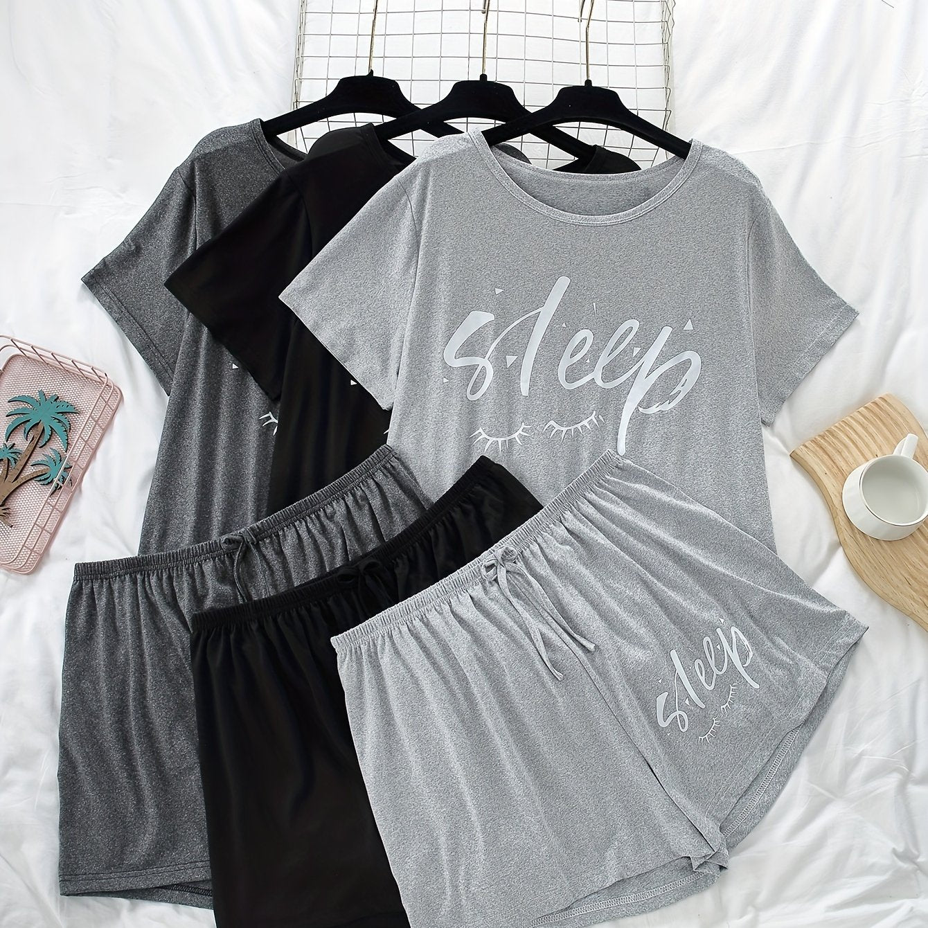 Women's 3-piece pajama set featuring alphabet print, polyester knit fabric with stretch, color block short sleeve top and shorts. Perfect for fall season lounging at home.