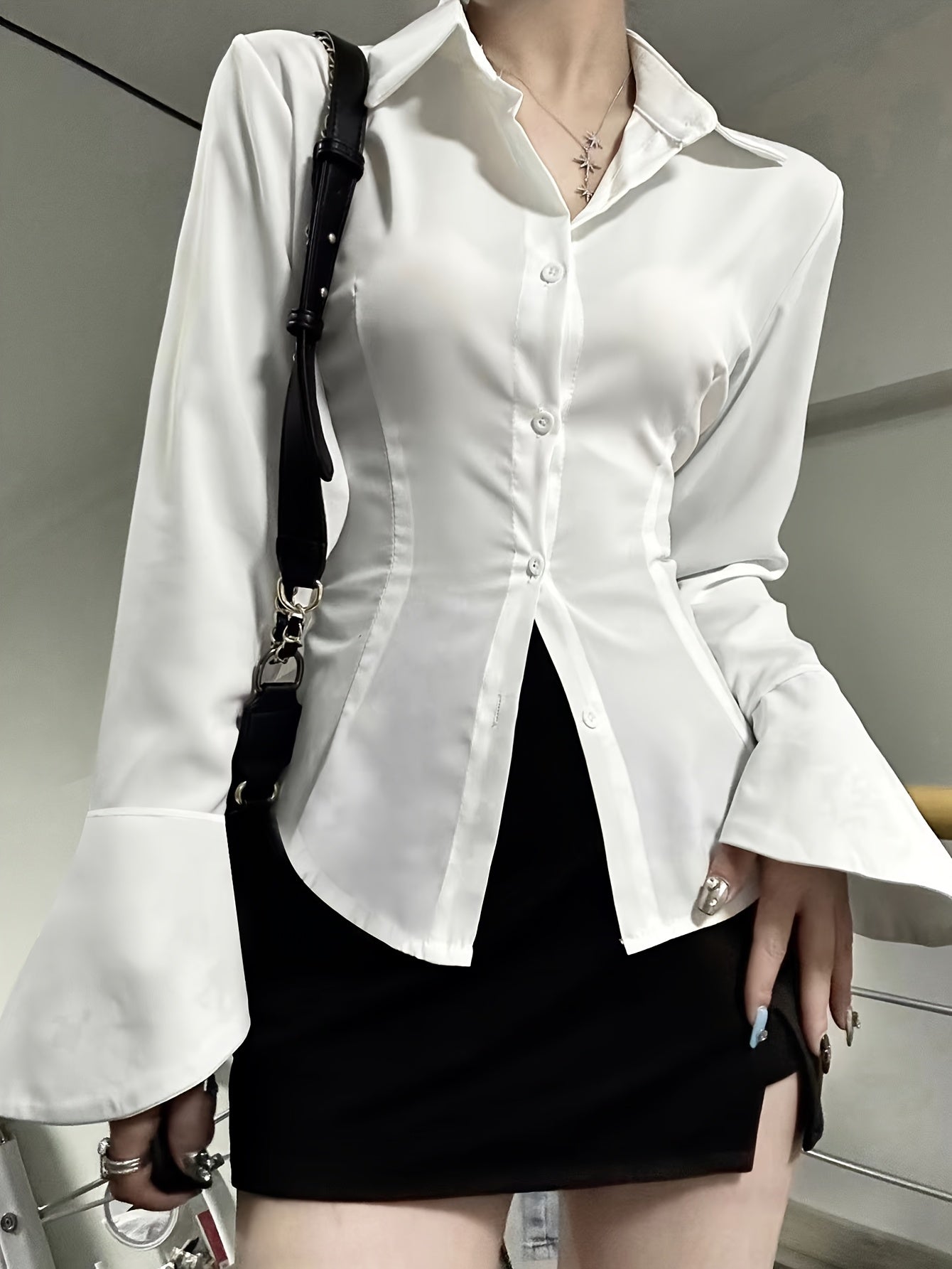 Chic solid color blouse for women with back tie detail and front buttons. Made of polyester blend, machine washable, ideal for all seasons.