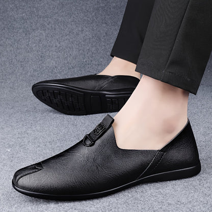 Sleek black slip-on shoes for men, breathable and fashionable with a durable sole.