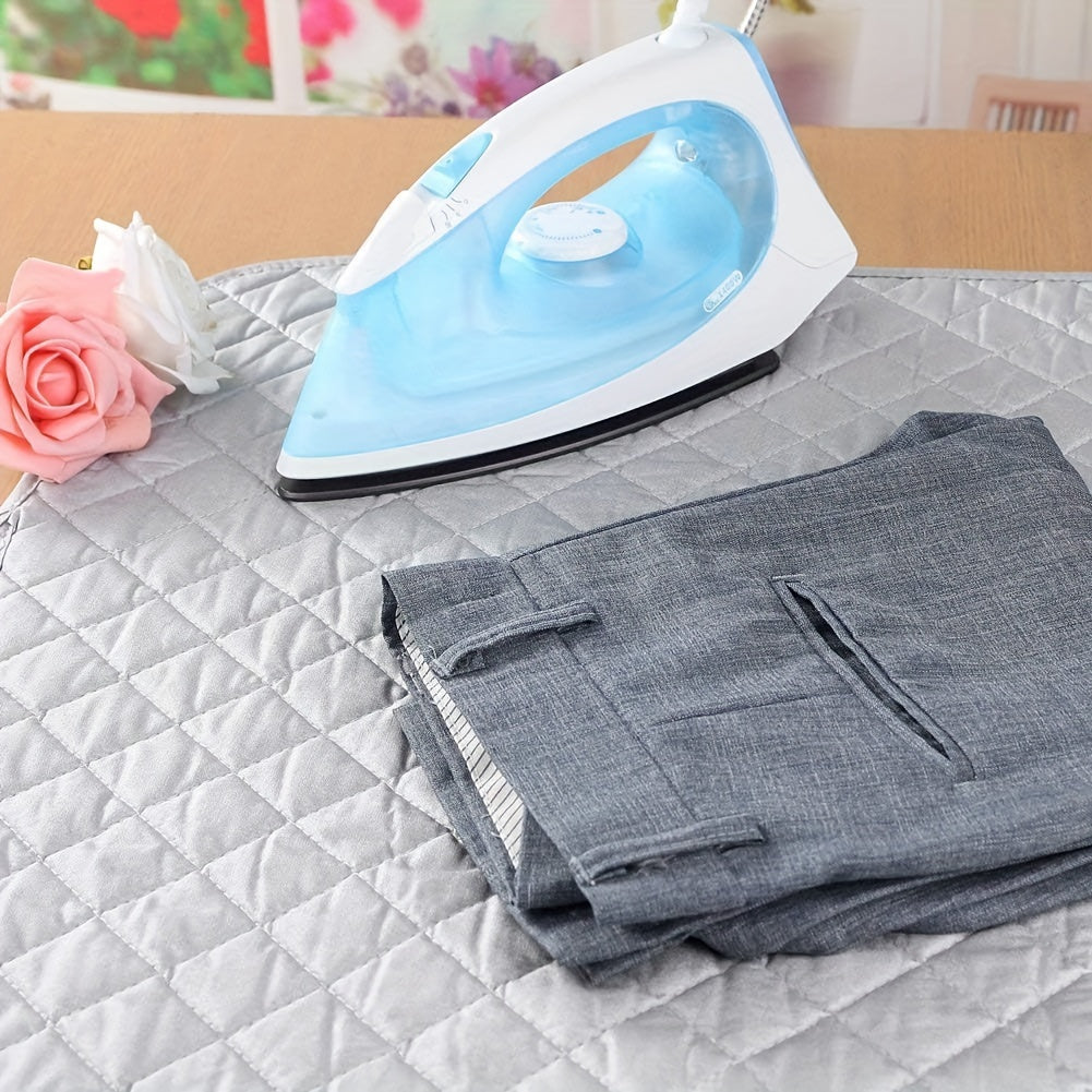 Portable ironing mat blanket, non-electric heat-resistant pad that is durable, washable, and dryable. Comes with a protective cover for clothes, perfect for laundry and pressing.