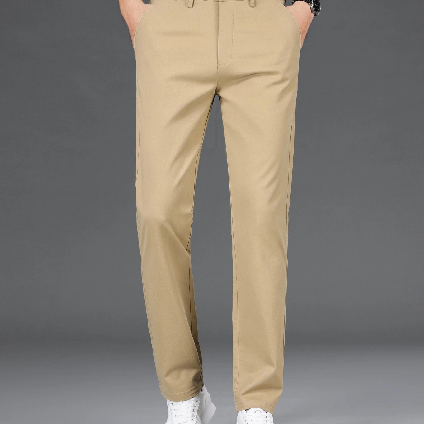 Men's slim-fit cotton blend trousers in solid color, suitable for business casual wear throughout the year. Features micro-elastic fabric, pockets, and regular length.