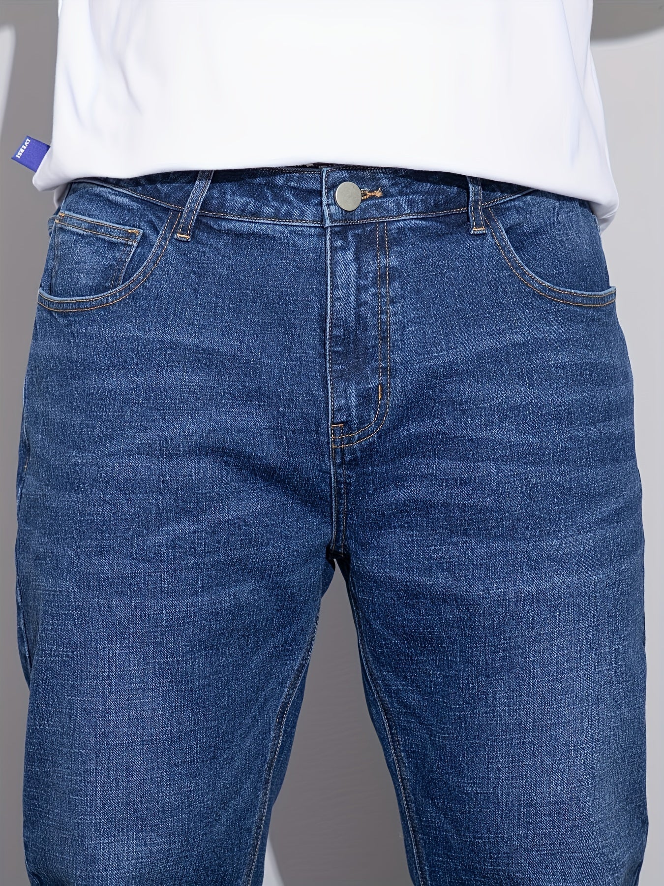 Men's plus size denim jeans with comfort flex, straight leg, washed detail, solid color, cotton blend with stretch.