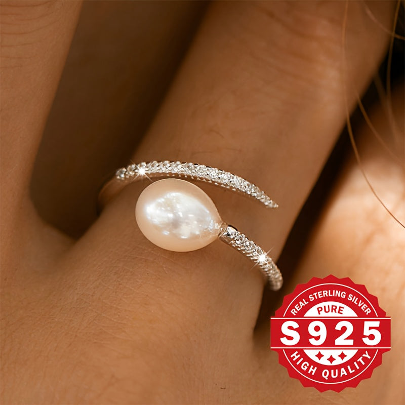 This elegant freshwater pearl ring for women is crafted from S925 sterling silver and adorned with artificial zirconia and freshwater pearls. Its stylish clash design makes it a unique gift option for festivals. Suitable for all occasions, this