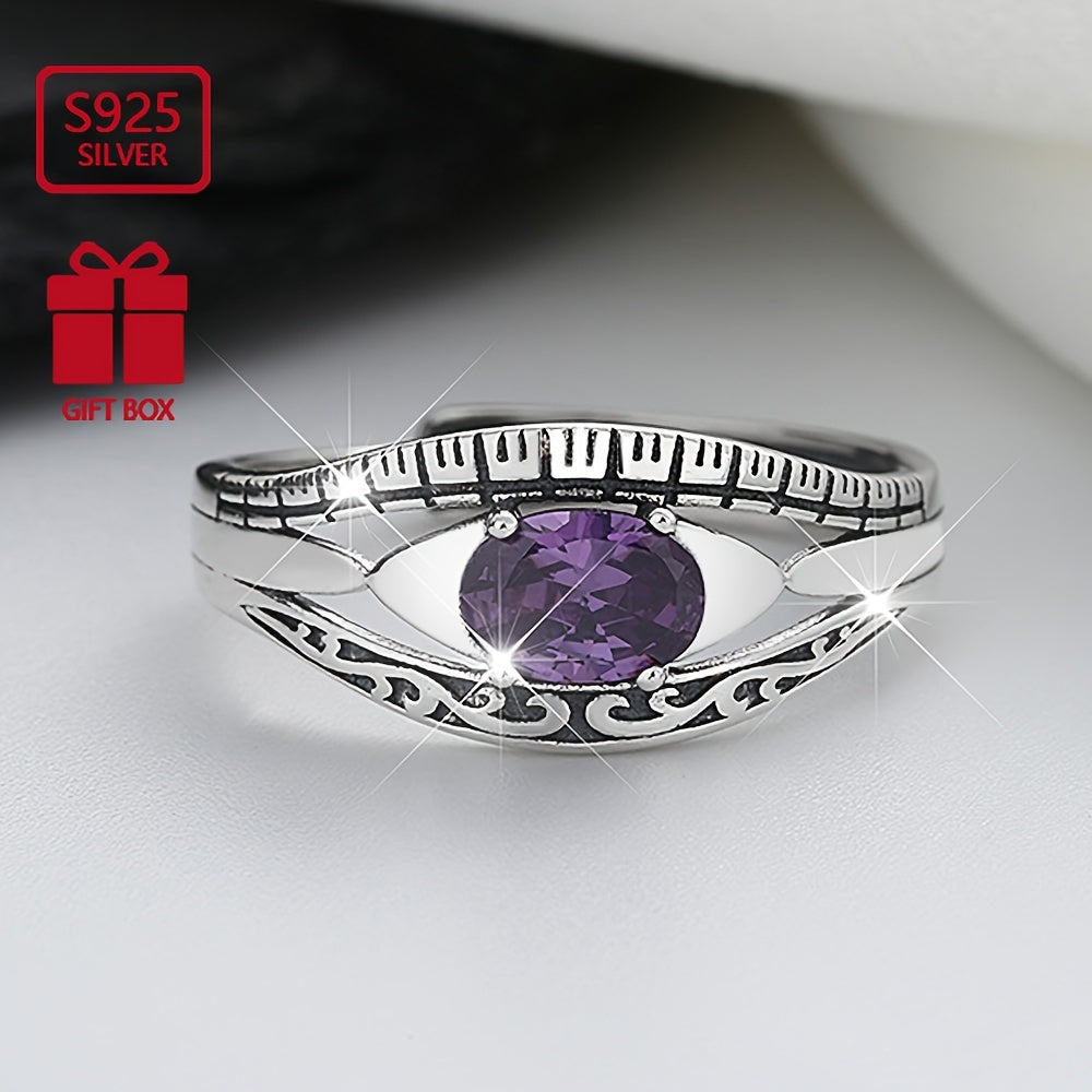 Beautiful and mysterious sterling silver ring with purple waterish zirconia inlay, symbolizing beauty and mystery. This high-quality adjustable ring is perfect for any occasion.