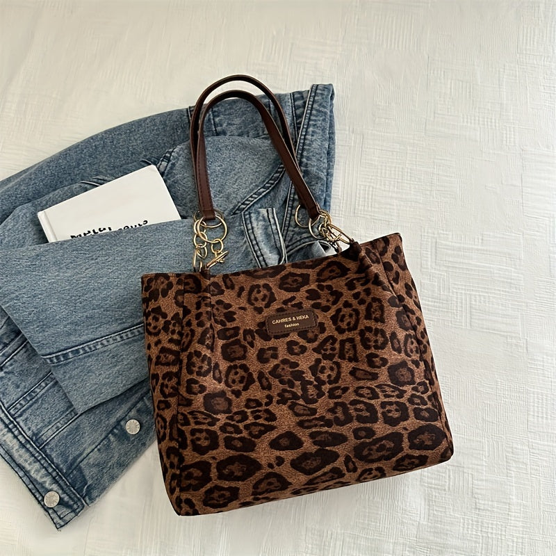 Stylish leopard print tote bag with large capacity for women, ideal for daily use with zip closure and fixed straps.