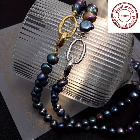 This necklace features a beautiful, natural freshwater cultured pearl measuring 7-9MM in a stunning blue-black hue. The clavicle length necklace is designed for women and showcases irregular baroque pearls with a unique texture and shape. Each pearl is