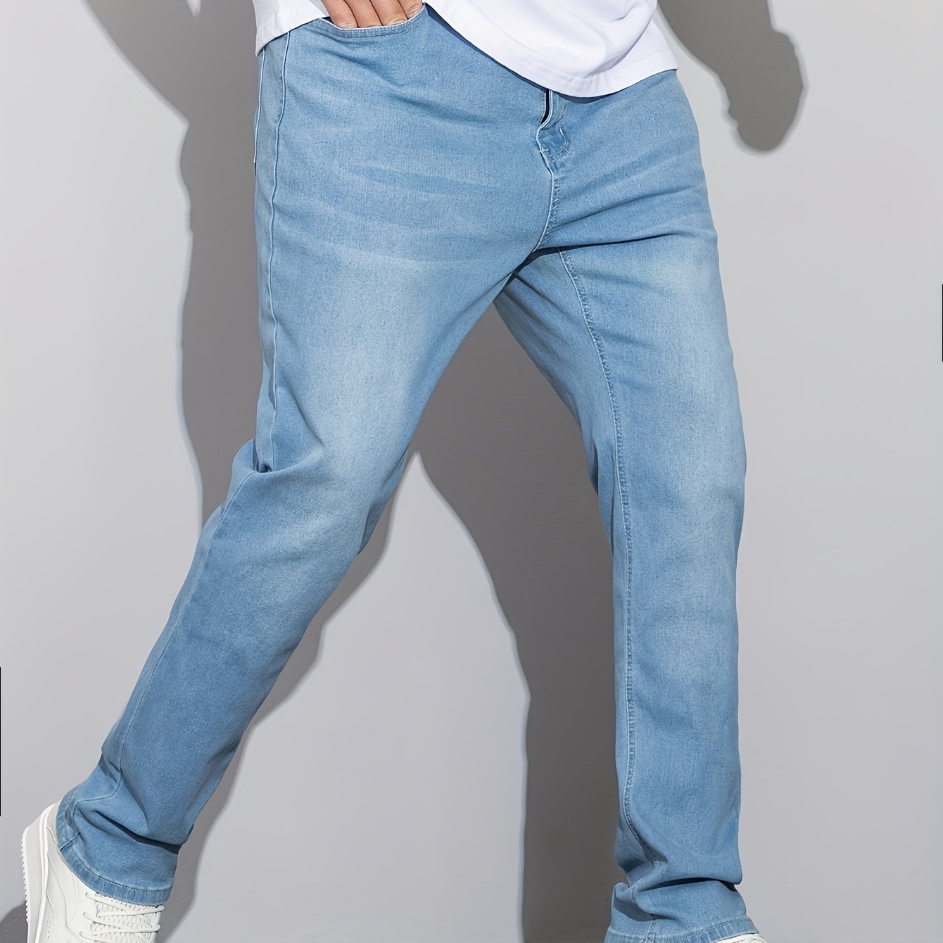 Stylish men's plus size denim pants for casual street style in spring and fall.