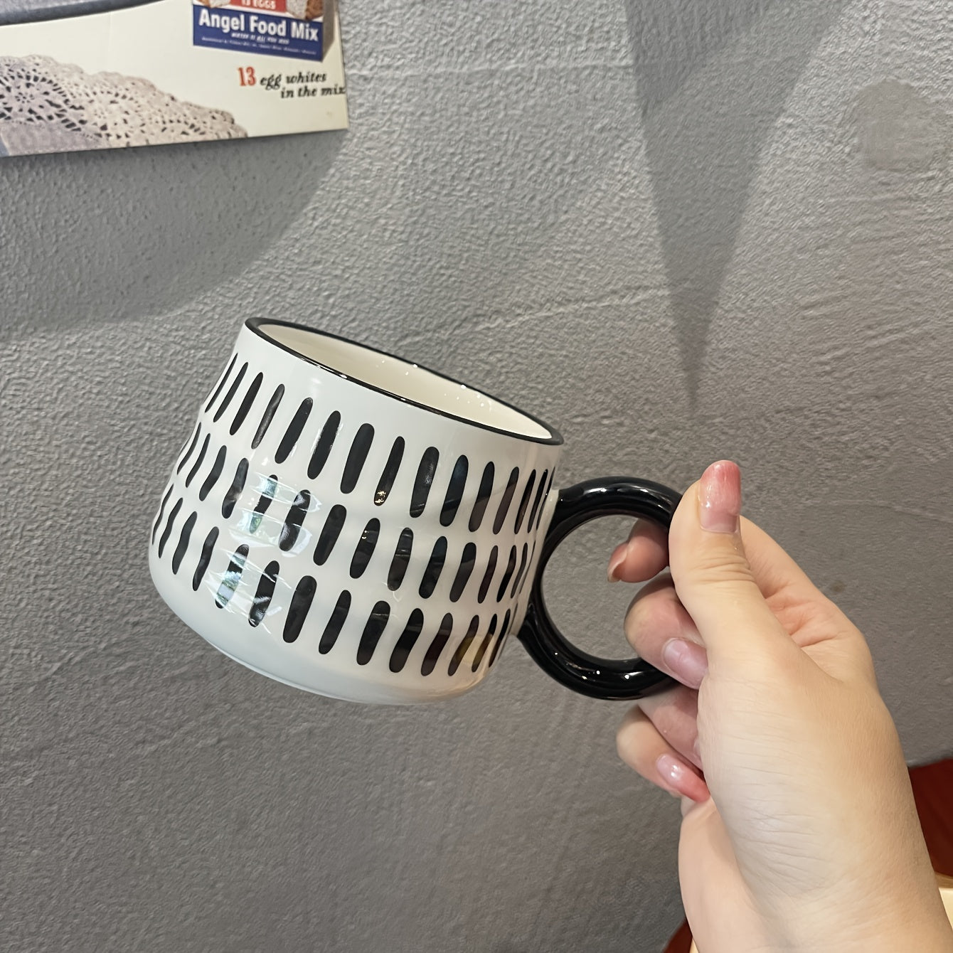 Stylish black and white checkered ceramic coffee mug - Ideal for home or restaurant use.