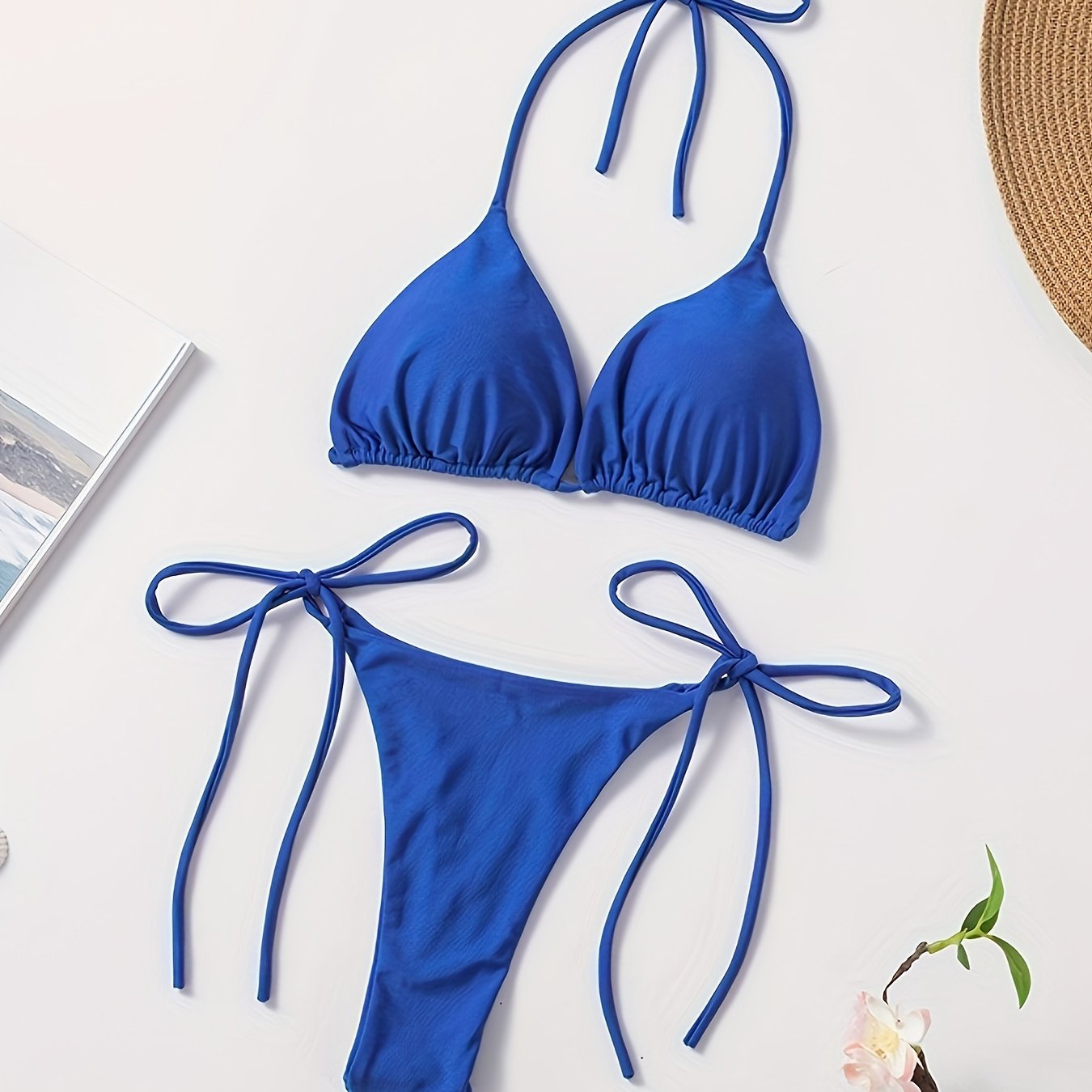 Women's two-piece bikini set with halter bra and V-string bottoms for swimwear.