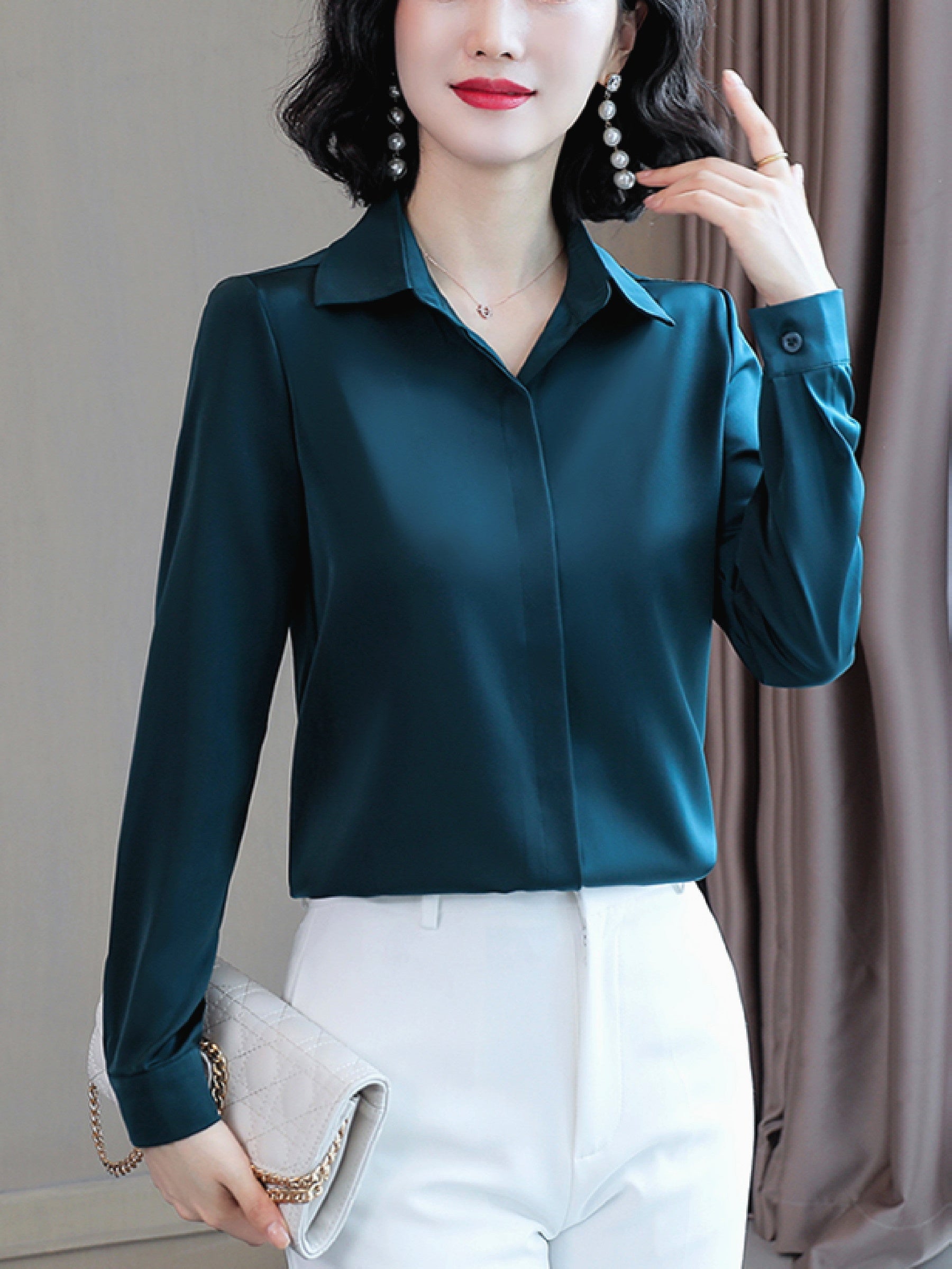 Long sleeve satin shirt with solid color, collared button-up design for women. Machine washable and perfect for spring/fall. Ideal for sophisticated adults with luxurious style.